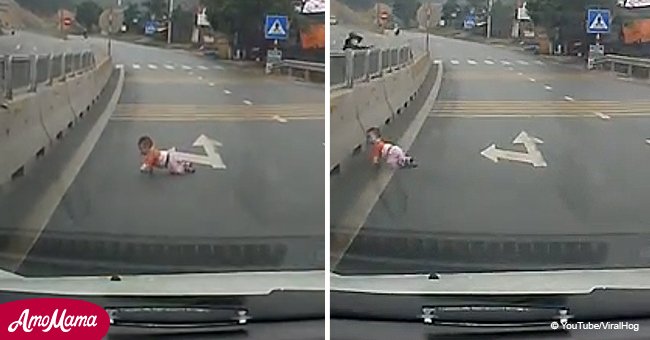 Dash camera shows baby crawling across a busy freeway