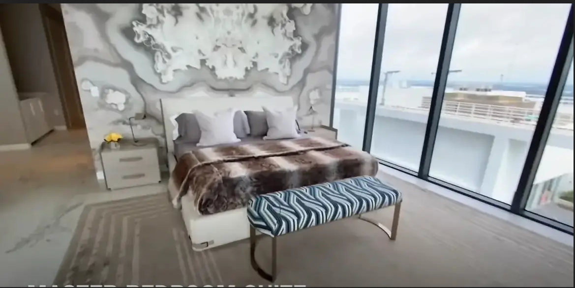Screenshot of a bedroom in a model unit with a similar floor plan as David and Victoria Beckham's penthouse | Youtube.com/Miami New Luxury Developments