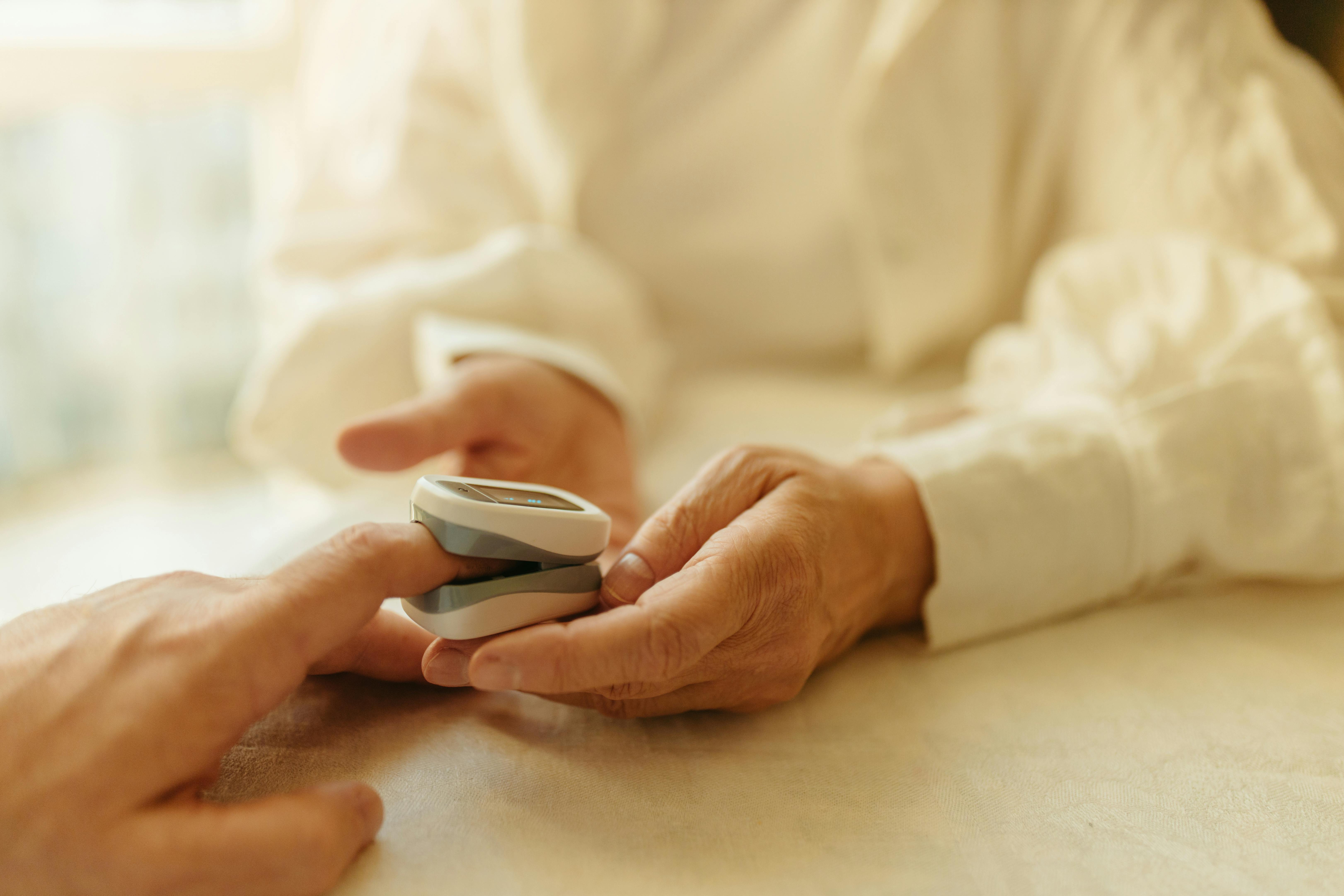 A woman wearing a pulse oximeter | Source: Pexels