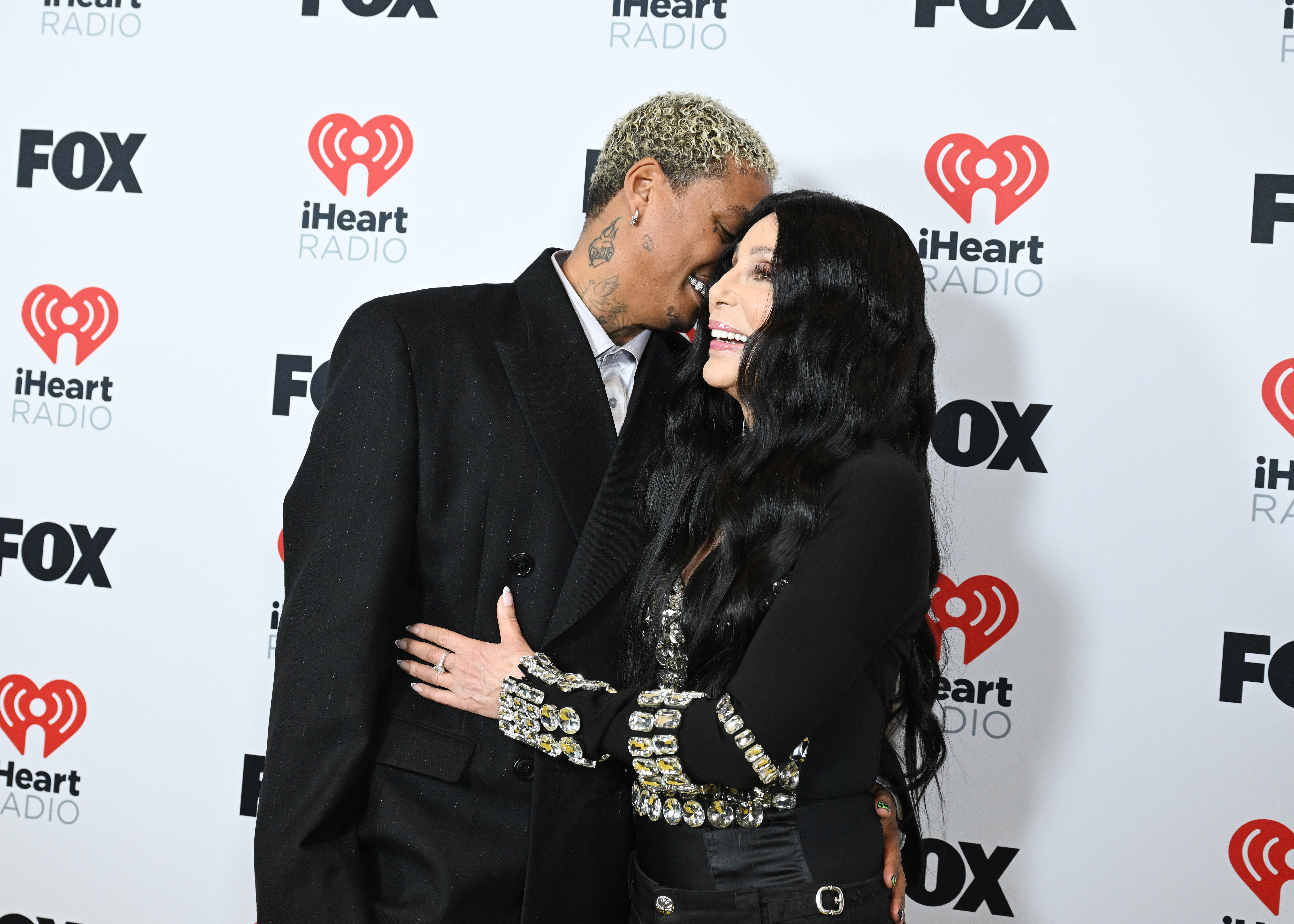 Alexander "AE" Edwards shares a sweet moment with Cher at the 2024 iHeartRadio Music Awards in Dolby Theatre on April 1, 2024, in Los Angeles, California. | Source: Getty Images