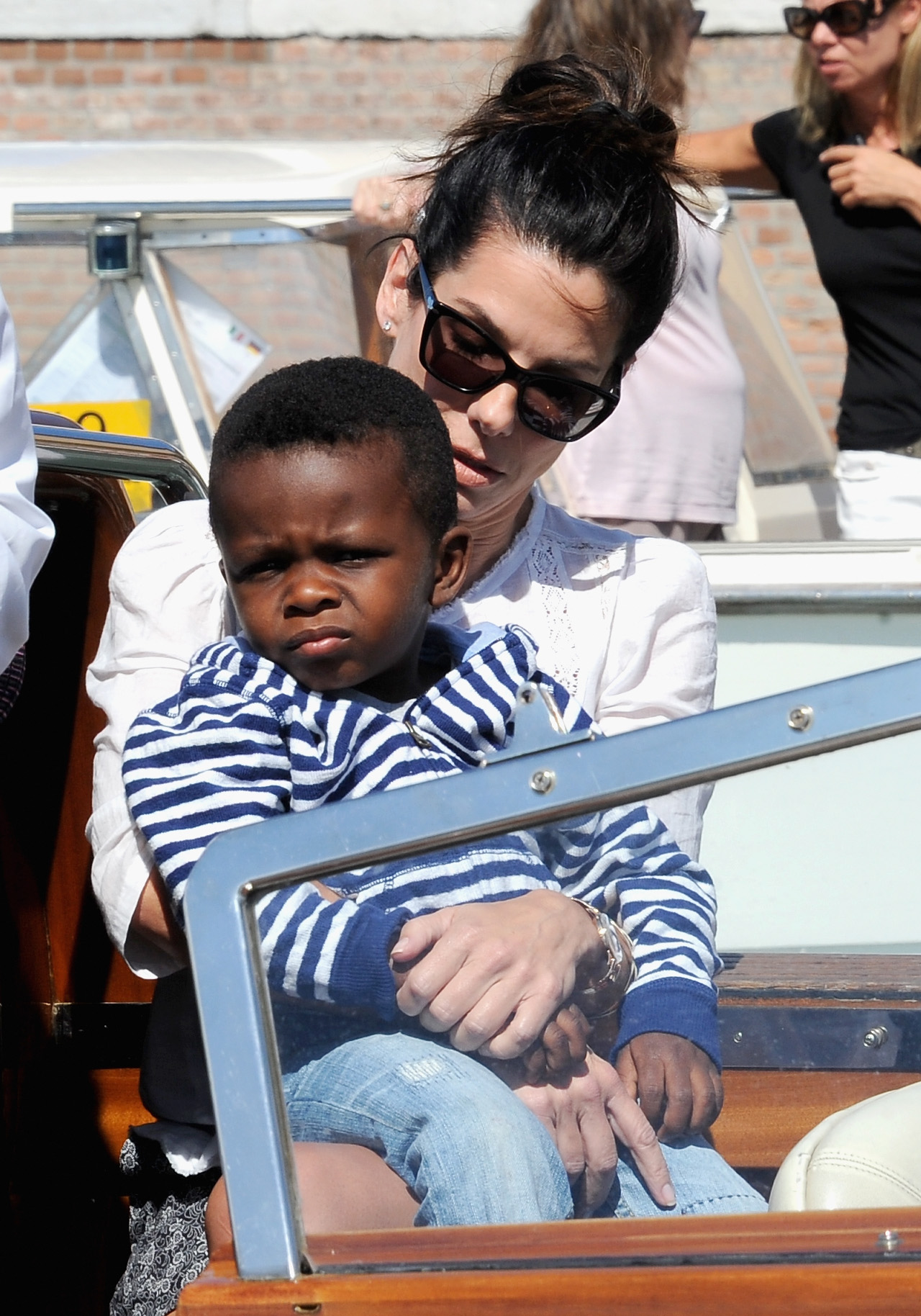 Sandra Bullock and her son Louis attend the 70th Venice International Film Festival on August 27, 2013, in Venice, Italy. | Source: Getty Images