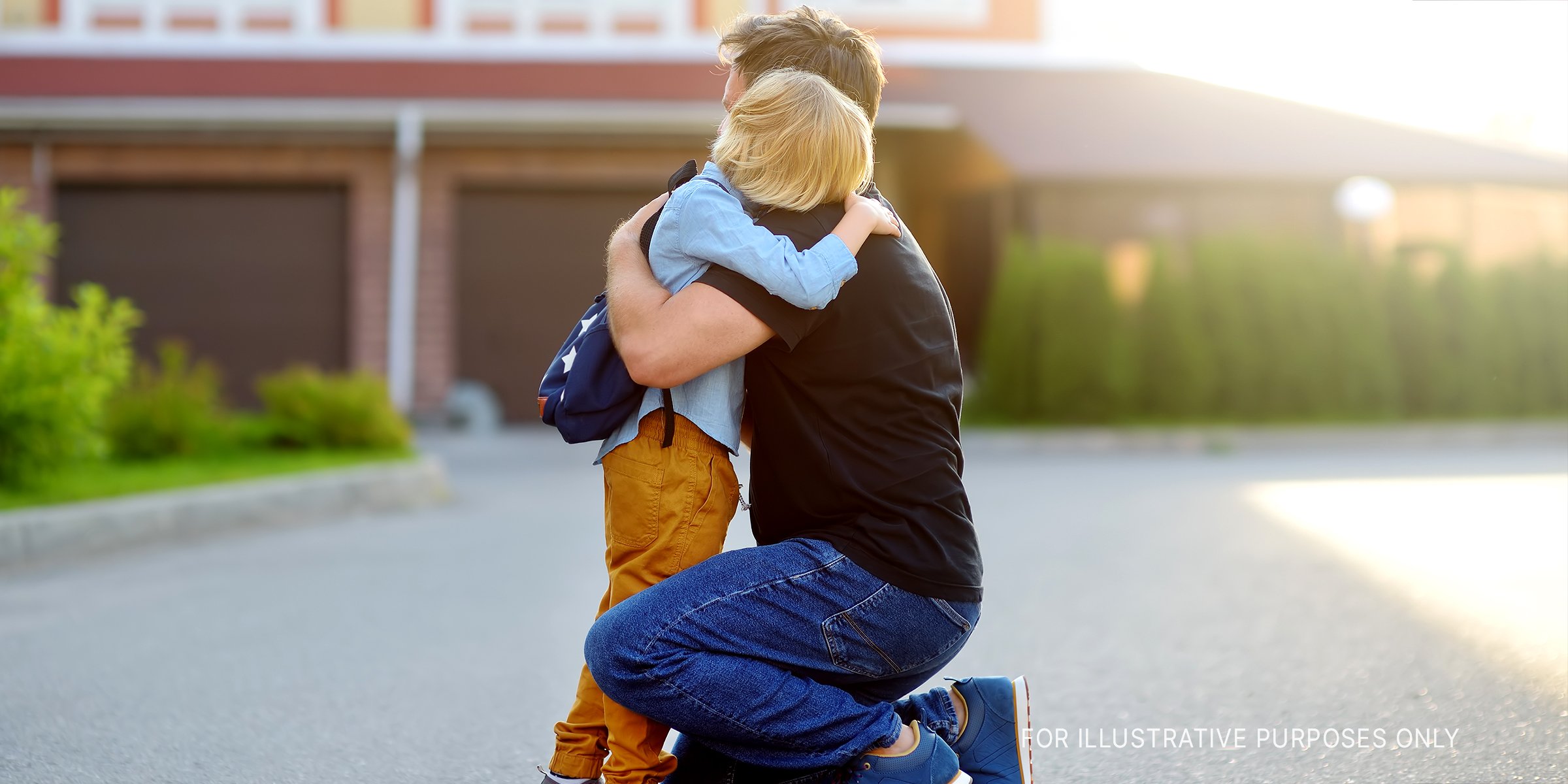 Little Boy Hugging His Father. | Source: Shutterstock