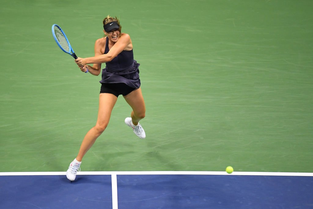 Maria Sharapova playing against Serena Williams in the first round of the US Open on Aug. 26, 2019 in New York City | Photo: Getty Images