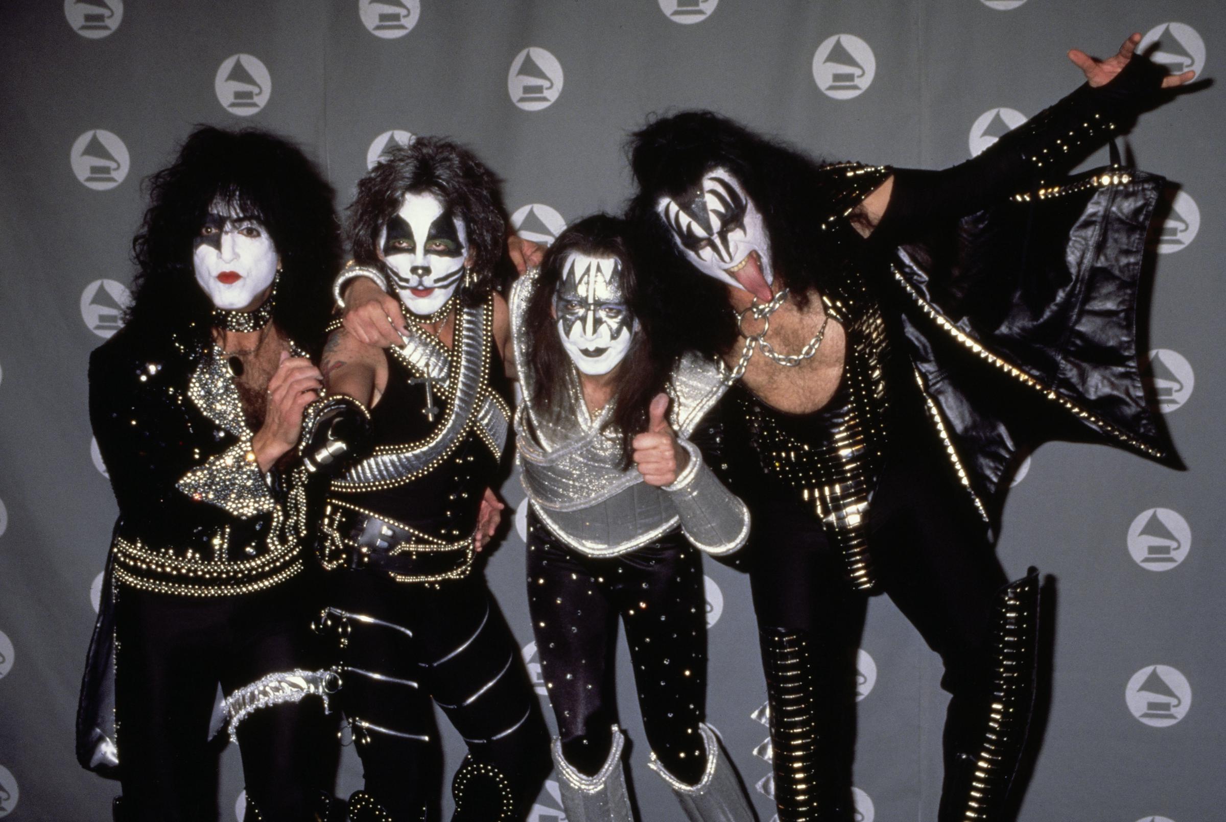 Paul Stanley, Peter Criss, Ace Frehley, and Gene Simmons of American rock band Kiss attend the 38th Annual Grammy Awards in Los Angeles, California, on February 28, 1996 | Source: Getty Images