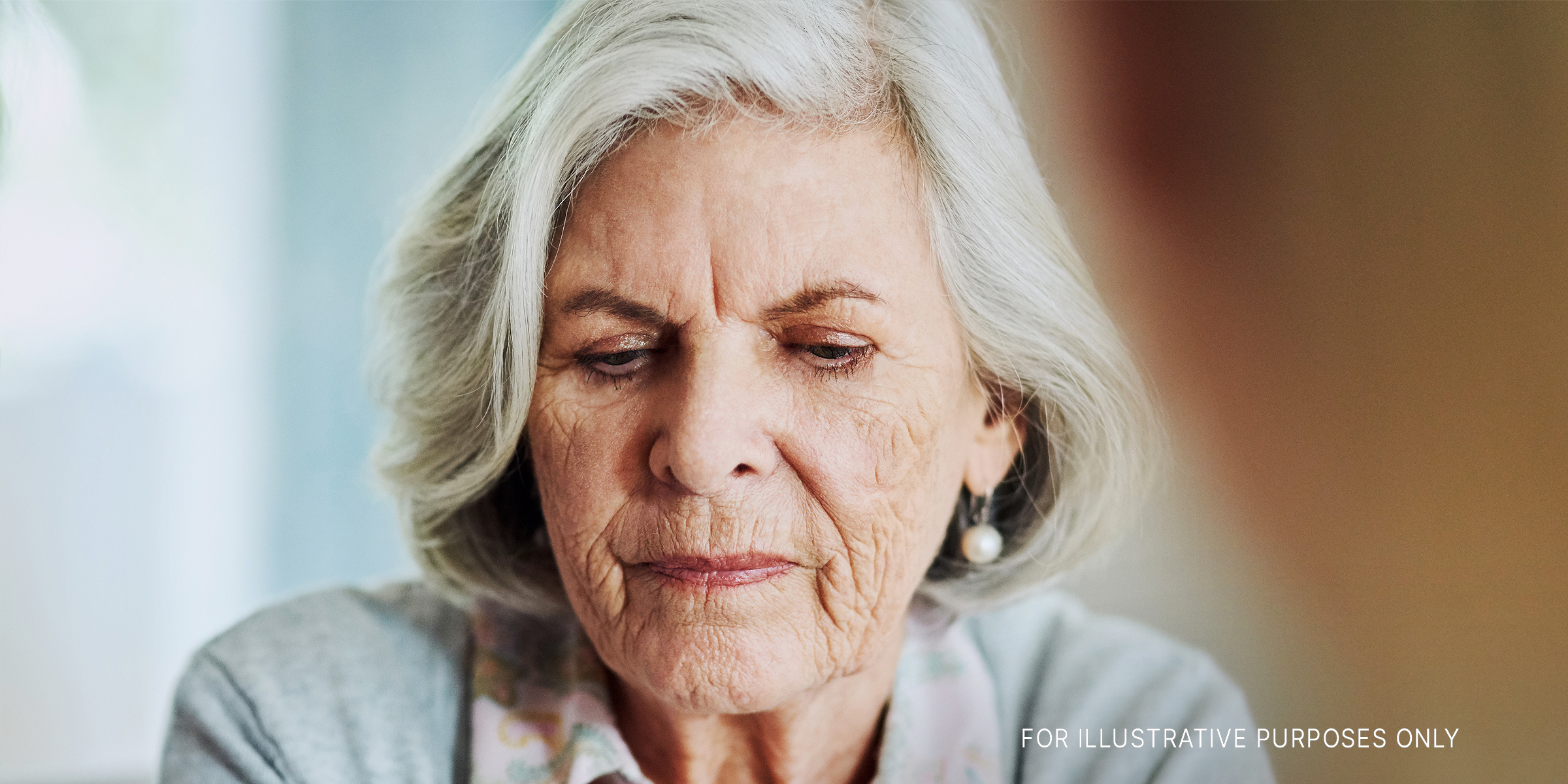 An upset older woman looking down | Source: Getty Images