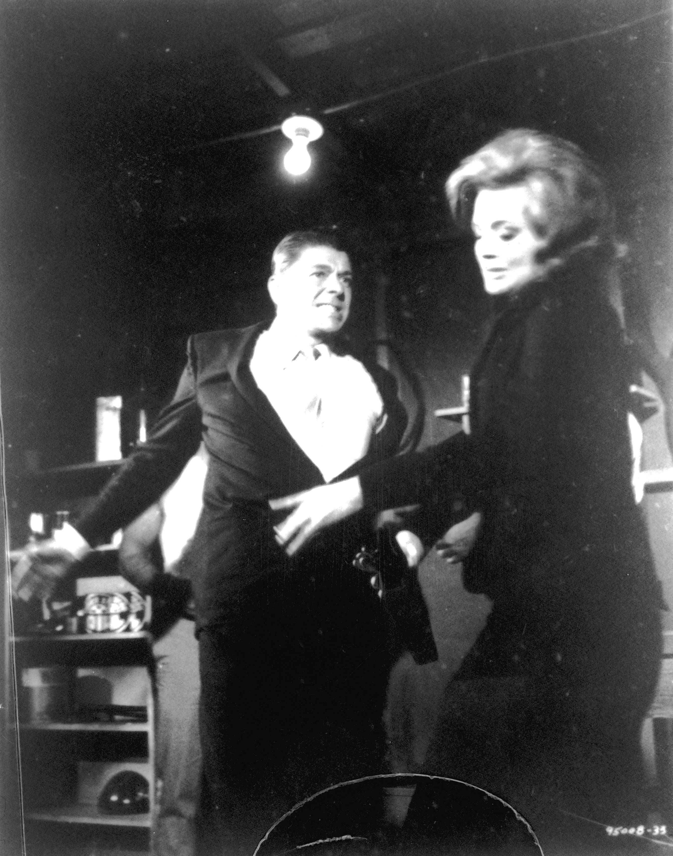 Ronald Reagan acting with Angie Dickinson in a scene from "The Killers" in1964. | Source: Universal Pictures/Getty Images