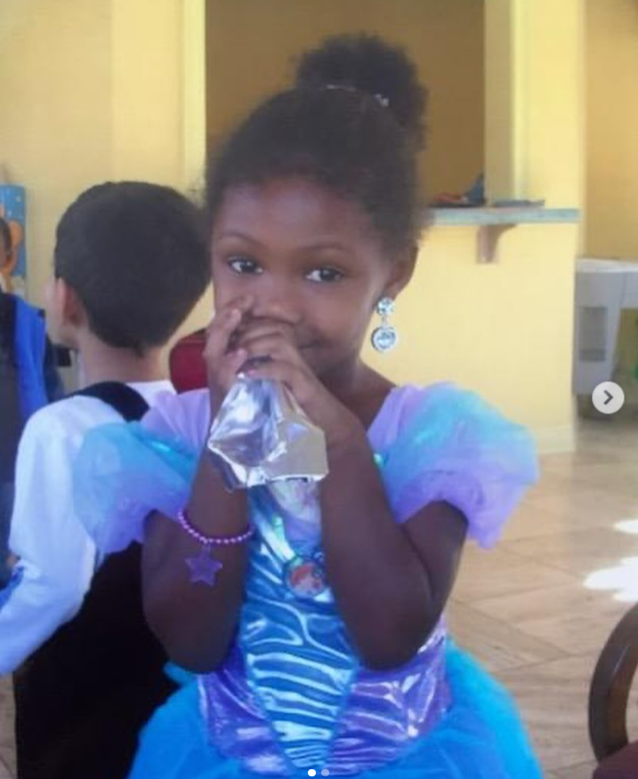A young Isan Elba stands indoors in a princess dress with puffed sleeves and a layered tulle skirt, from a post dated January 4, 2024. | Source: Instagram/isanelba