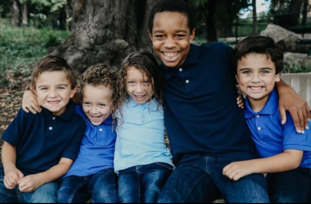 A photo of Giovanni Pelletier bonding with his younger siblings  posted by his family on August 9, 2025 | Source: GoFundme