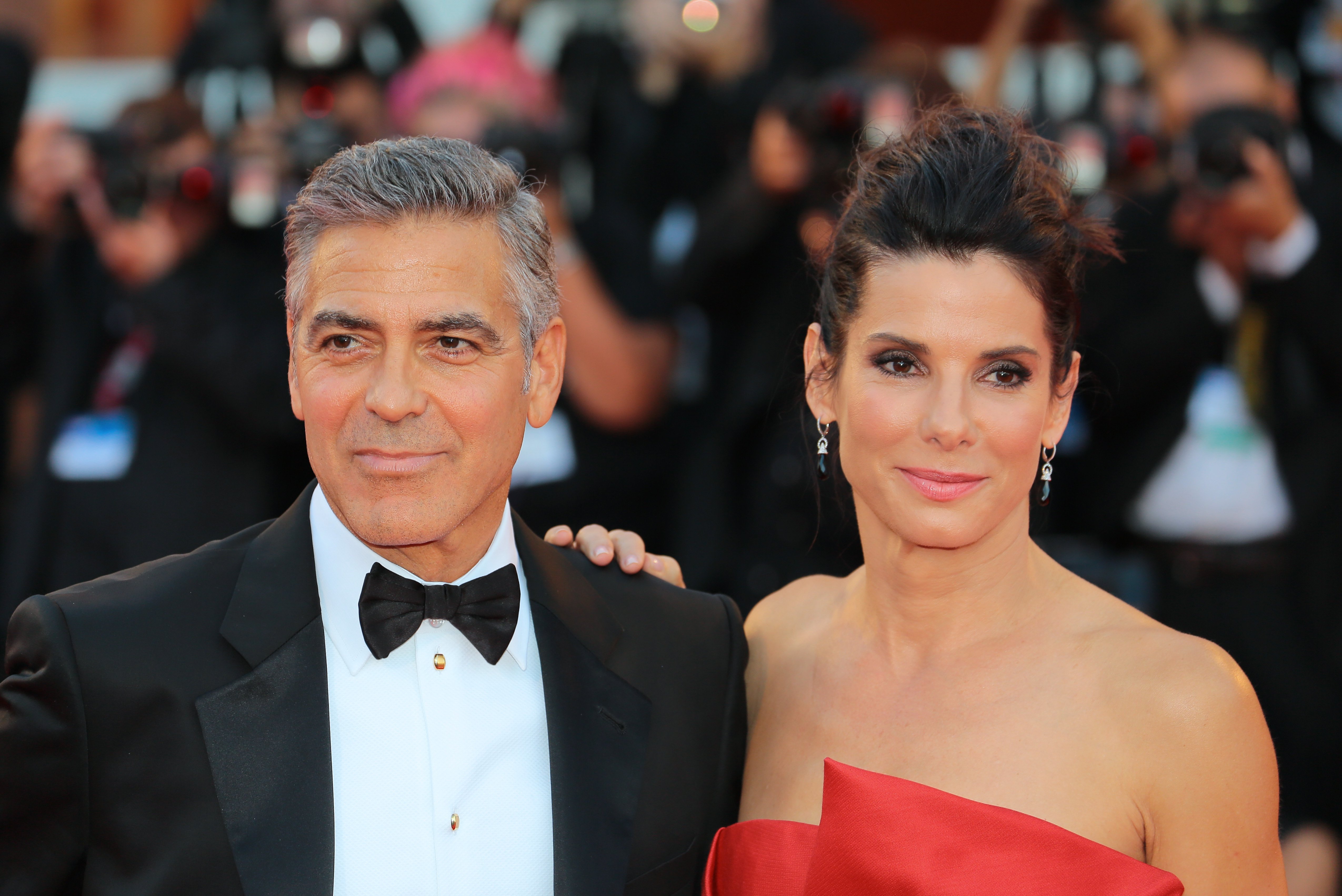 George Clooney, and co-star, Sandra Bullock at the "Gravity" premiere in Venice, August, 2012. | Photo: Shutterstock. 