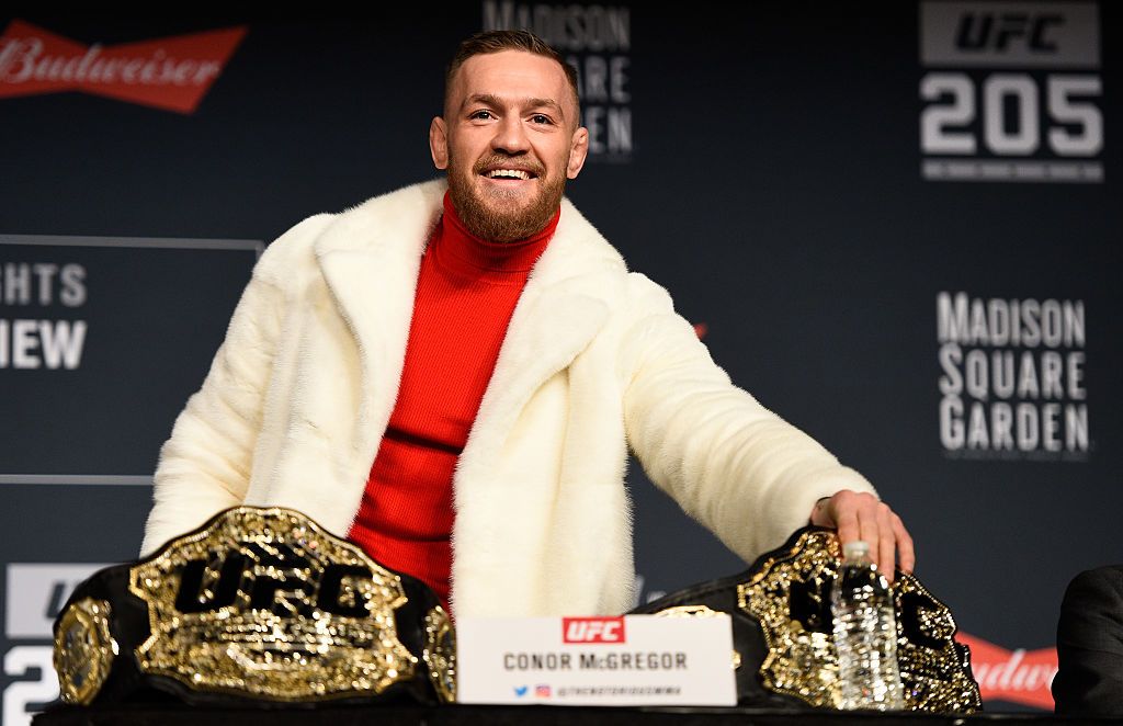 Conor McGregor showing off his Featherweight and Lightweight championship belts during the UFC 205 press conference at Madison Square Garden in New York City | Photo:  Getty Images