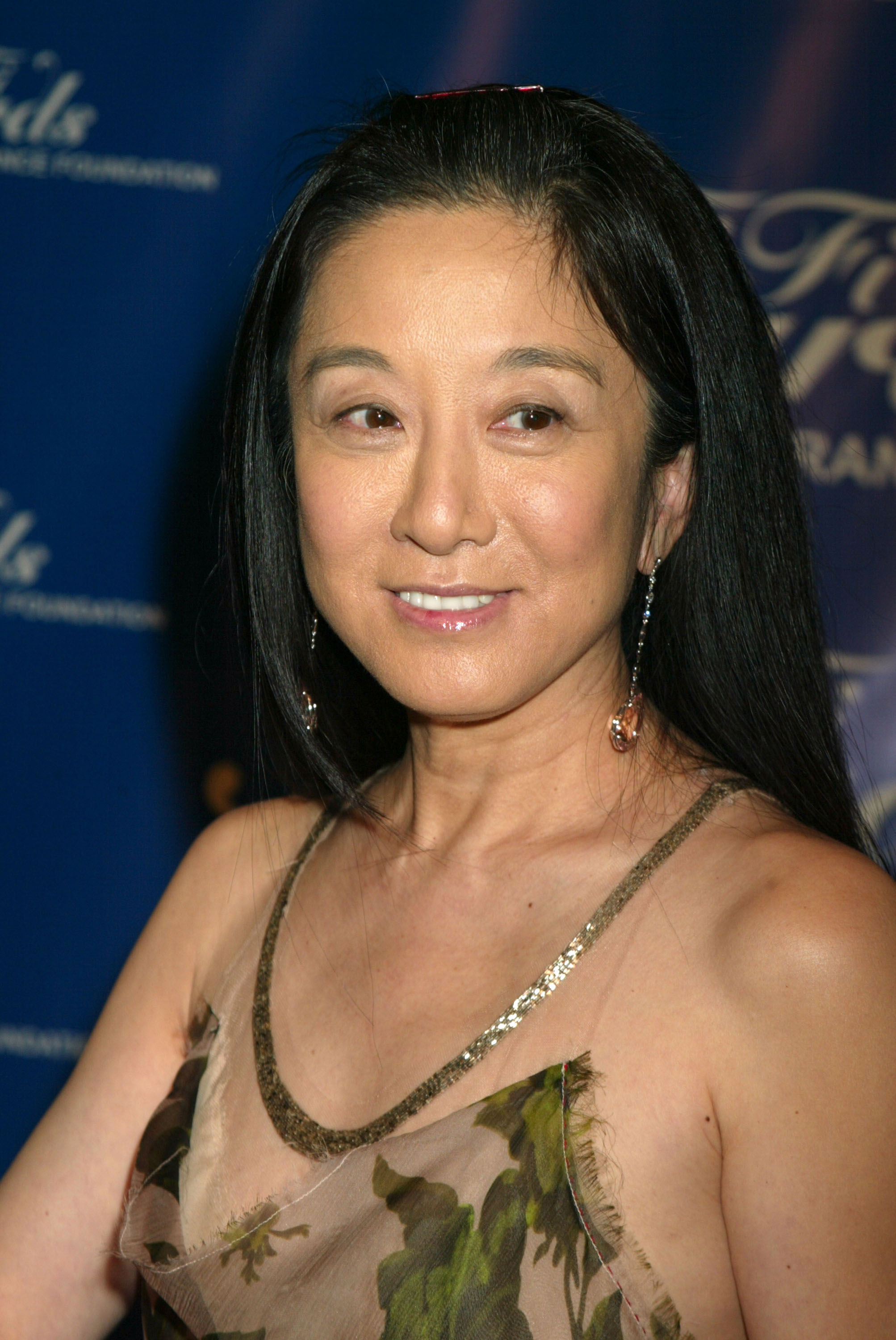 The iconic fashion designer frequently attributed her youthful appearance to her Asian heritage. At this event, she arrived for the Fragrance Foundation's Annual "FiFi" Awards at Hammerstein Ballroom on June 9, 2004, in New York City, New York. | Source: Getty Images