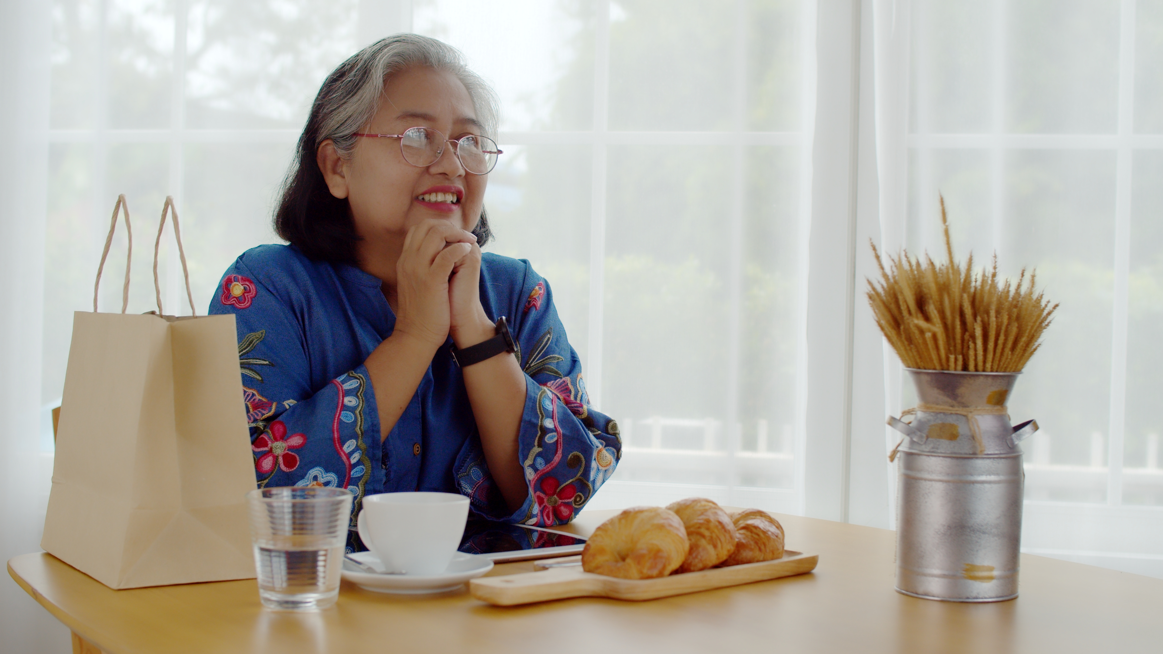 Woman reflecting over coffee | Source: Shutterstock