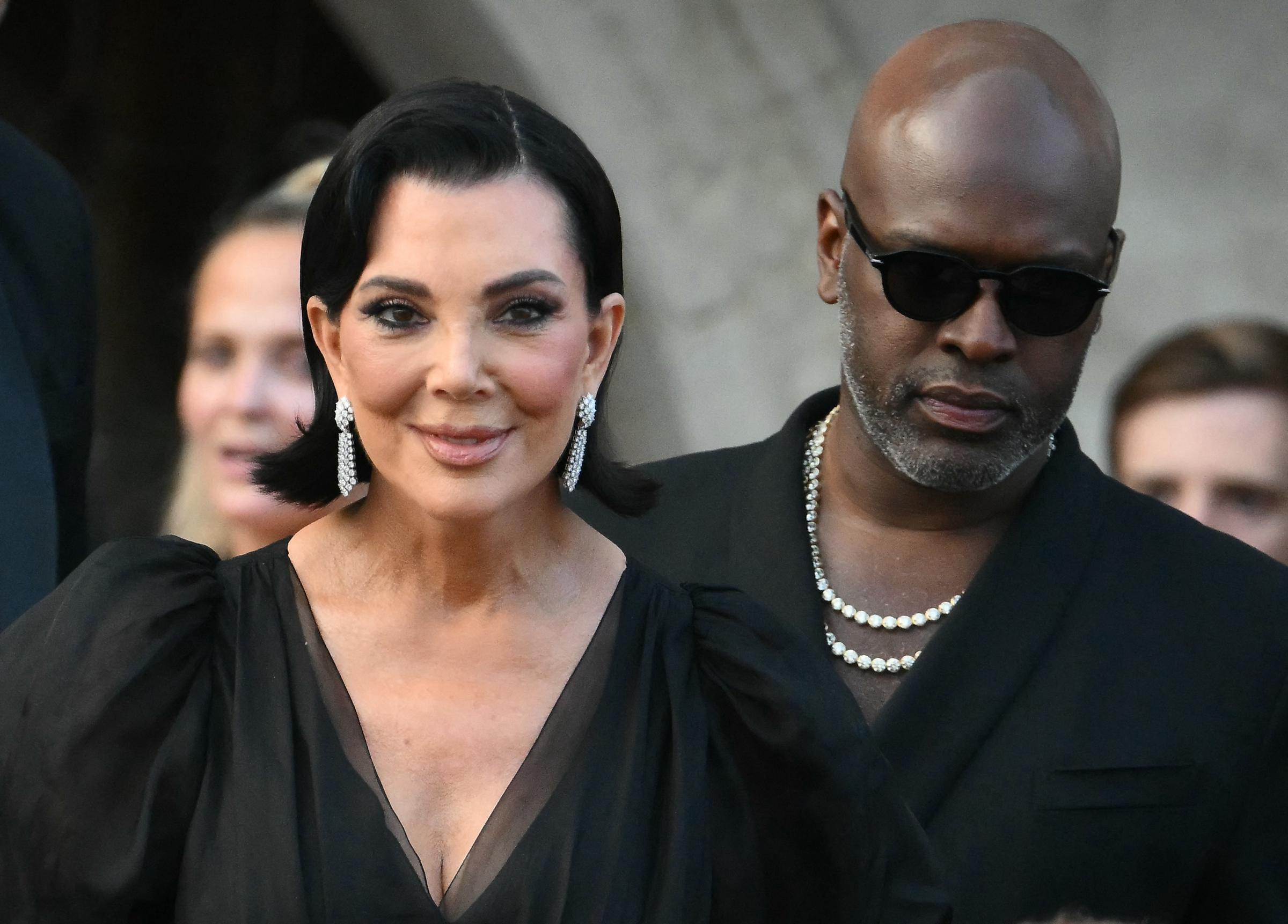 US television personality Kris Jenner and Corey Gamble leave the Gritti Palace Hotel ahead of Jeff Bezos with Lauren Sanchez's wedding. They are both dressed in black.