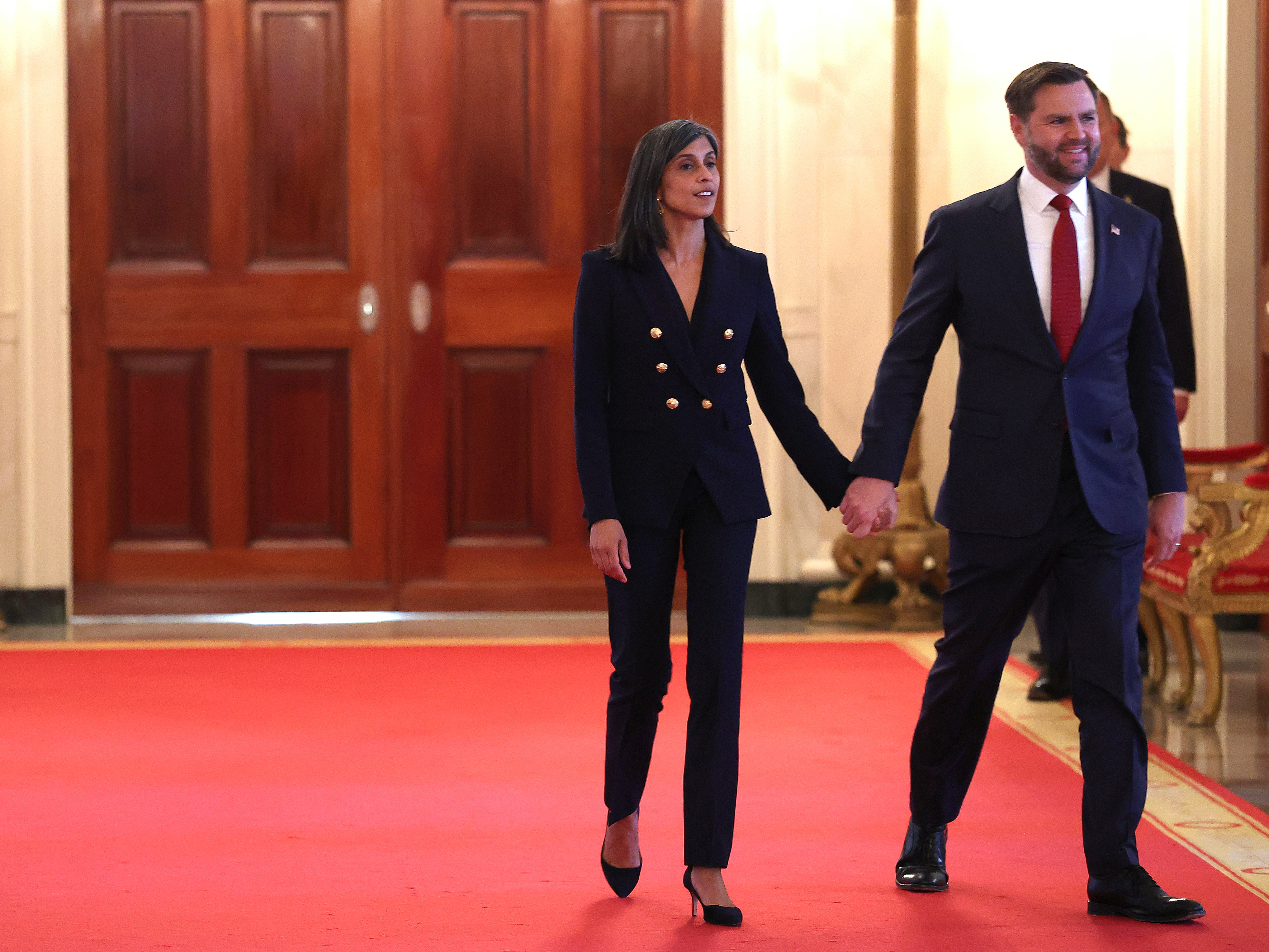 Usha and JD Vance arrive for the signing ceremony for the "Fostering the Future" executive order in the East Room at the White House on November 13, 2025 in Washington, DC | Source: Getty Images
