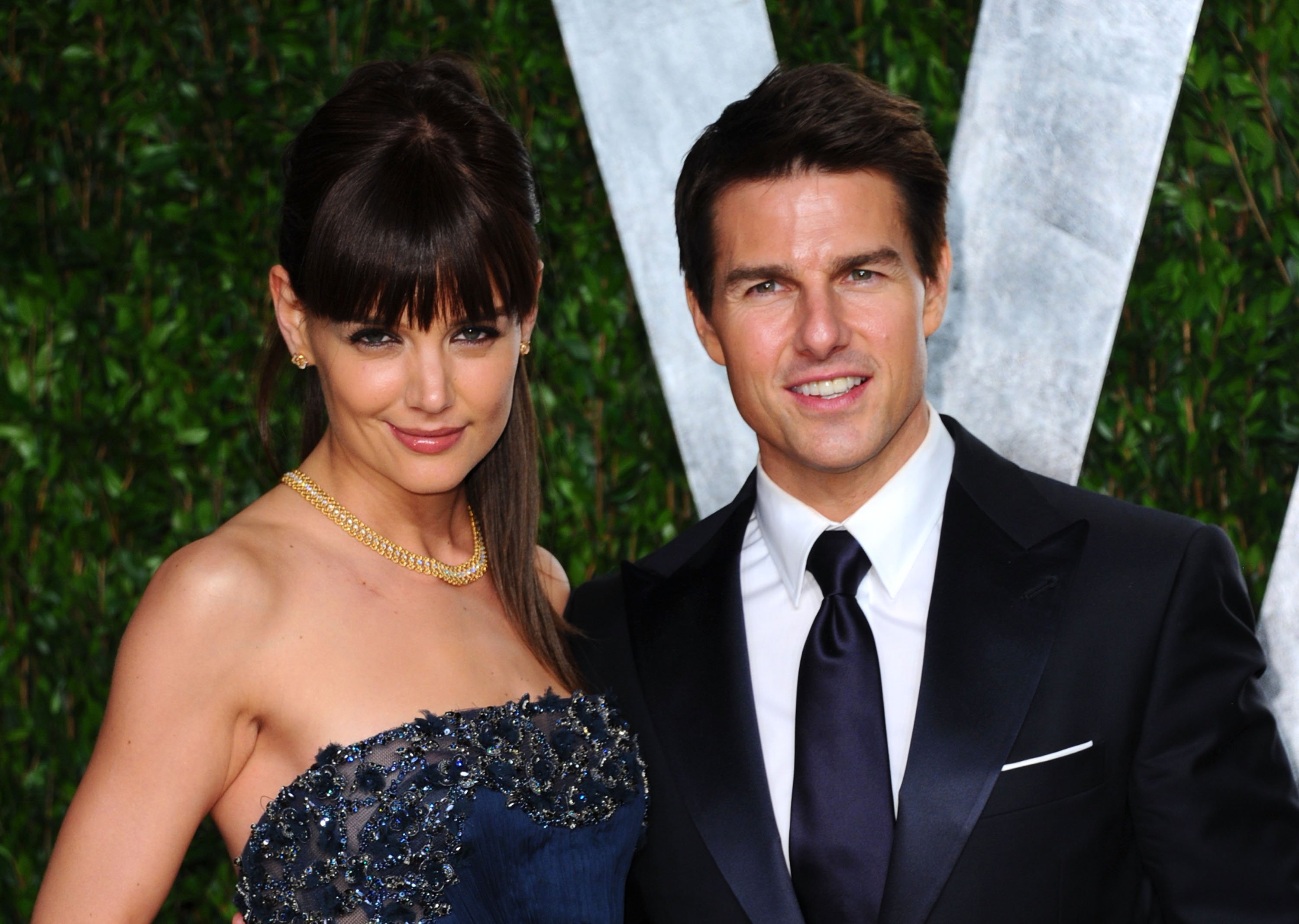 Katie Holmes (L) and actor Tom Cruise arrives at the 2012 Vanity Fair Oscar Party hosted by Graydon Carter at Sunset Tower on February 26, 2012. | Source: Getty Images