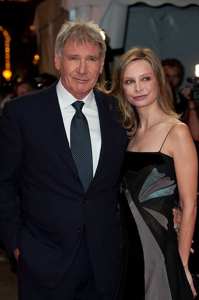 Harisson Ford et Calista Flockhart posent pour la projection du film `` La proposition '' au 35e Festival du film américain de Deauville, France le 12 septembre 2009. | Photo : Getty Images