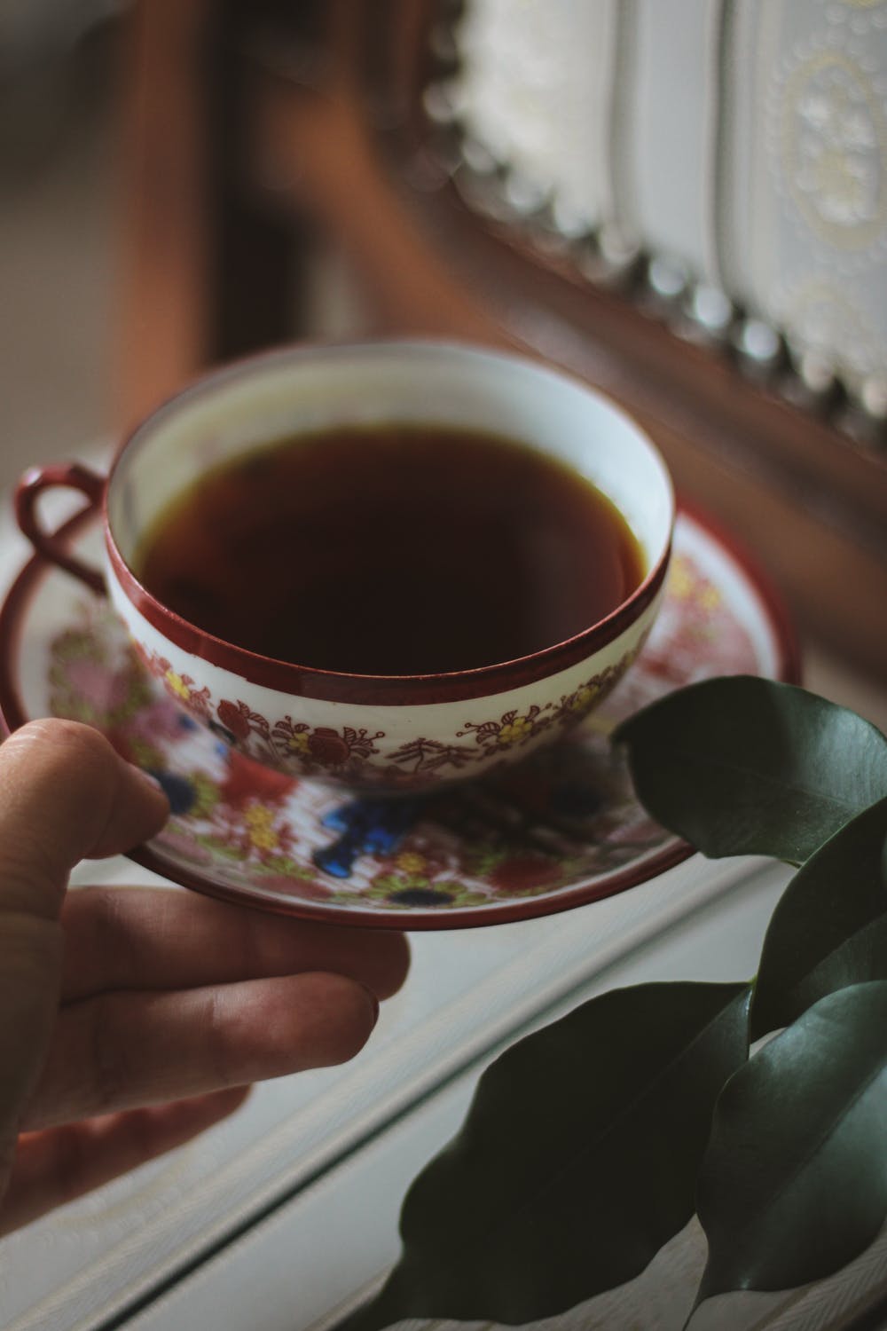 Evie picked up a cup of hot tea and some sandwiches | Source: Pexels