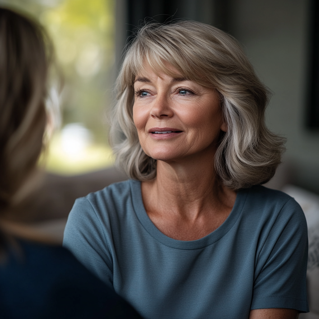 A middle-aged woman looks thoughtful while talking to someone | Source: Midjourney