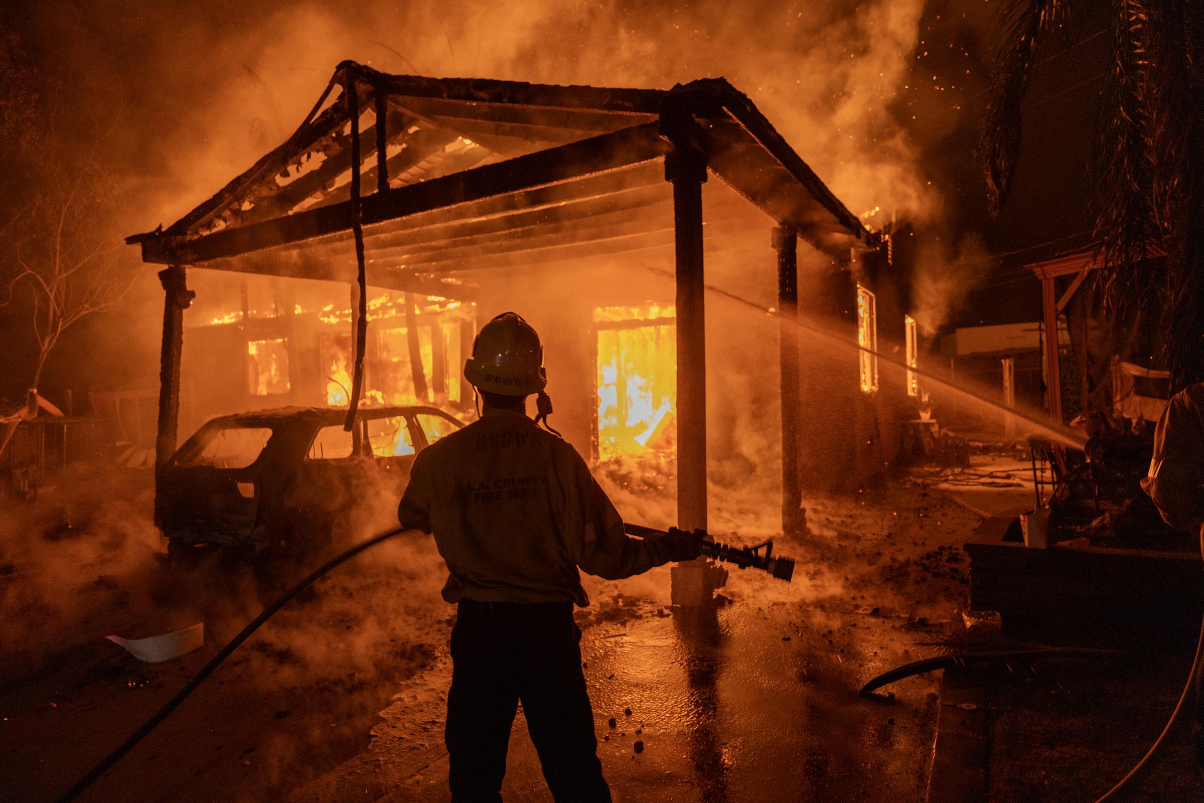 Firefighters battle the Eaton Fire on January 8, 2025, in Altadena, California | Source: Getty Images