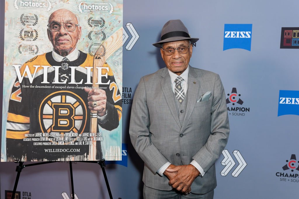 Willie Eldon O'Ree posing with his poster for his movie "Willie" at the Los Angeles Film Festival on October 25, 2019, in Los Angeles, California | Source: Presley Ann/Getty Images