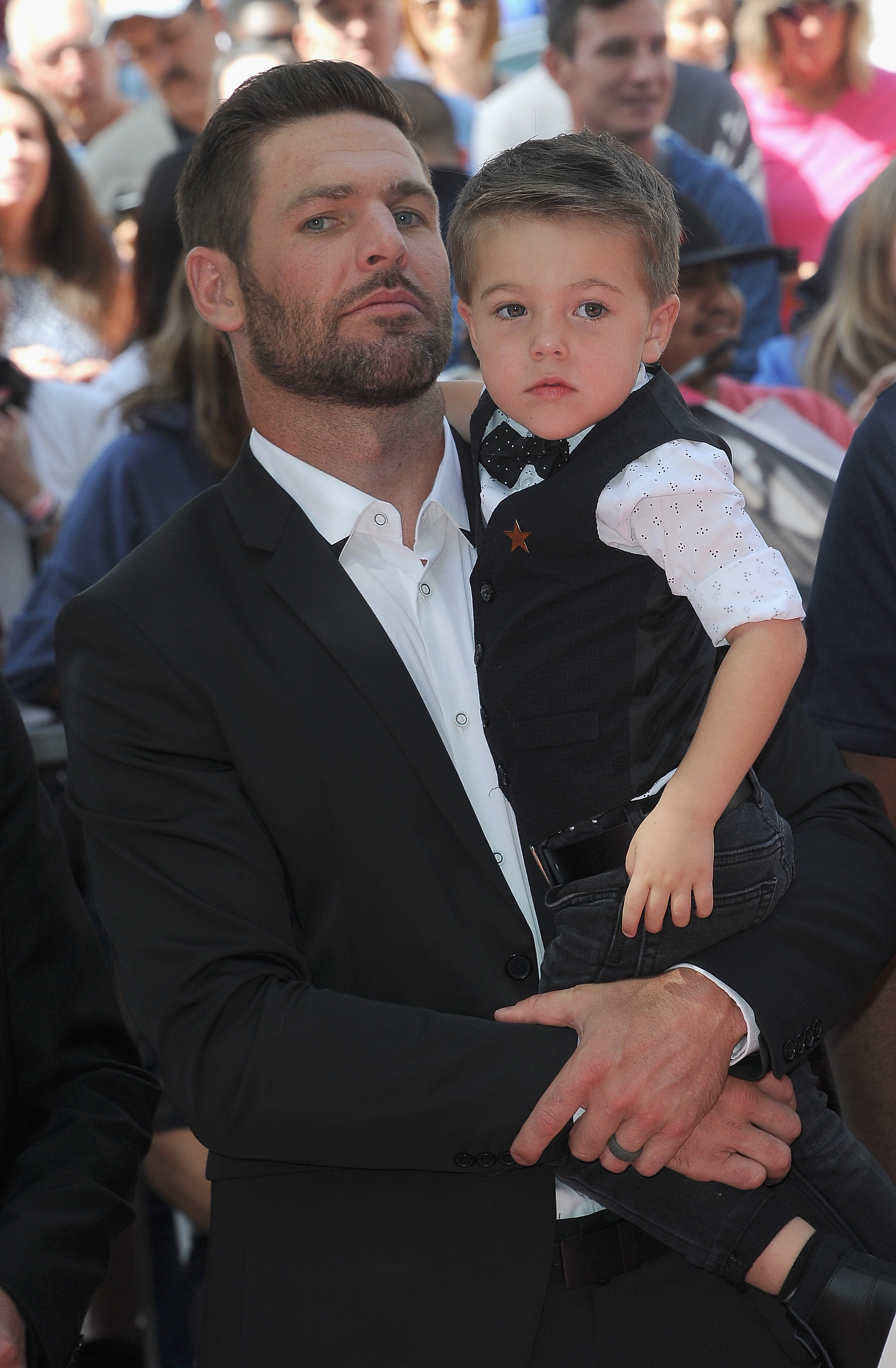 Mike and Isaiah Fisher at Carrie Underwood's star ceremony on the Hollywood Walk of Fame on September 20, 2018, in Hollywood, California. | Source: Getty Images