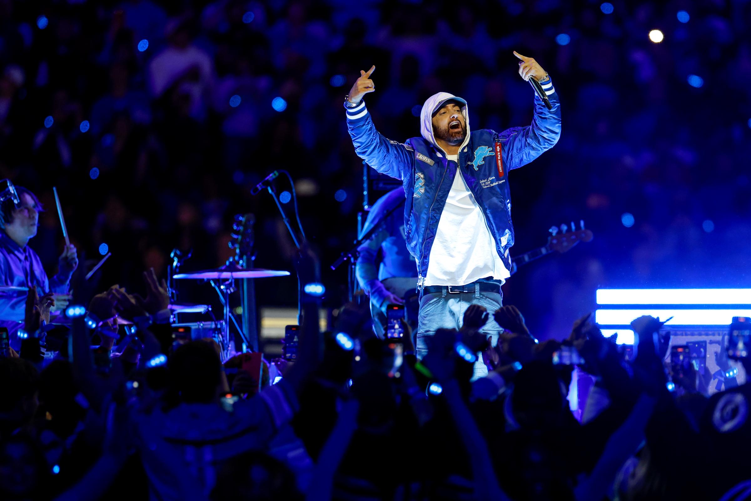 Eminem performs during the halftime show of the game between the Green Bay Packers and the Detroit Lions on November 27, 2025 | Source: Getty Images