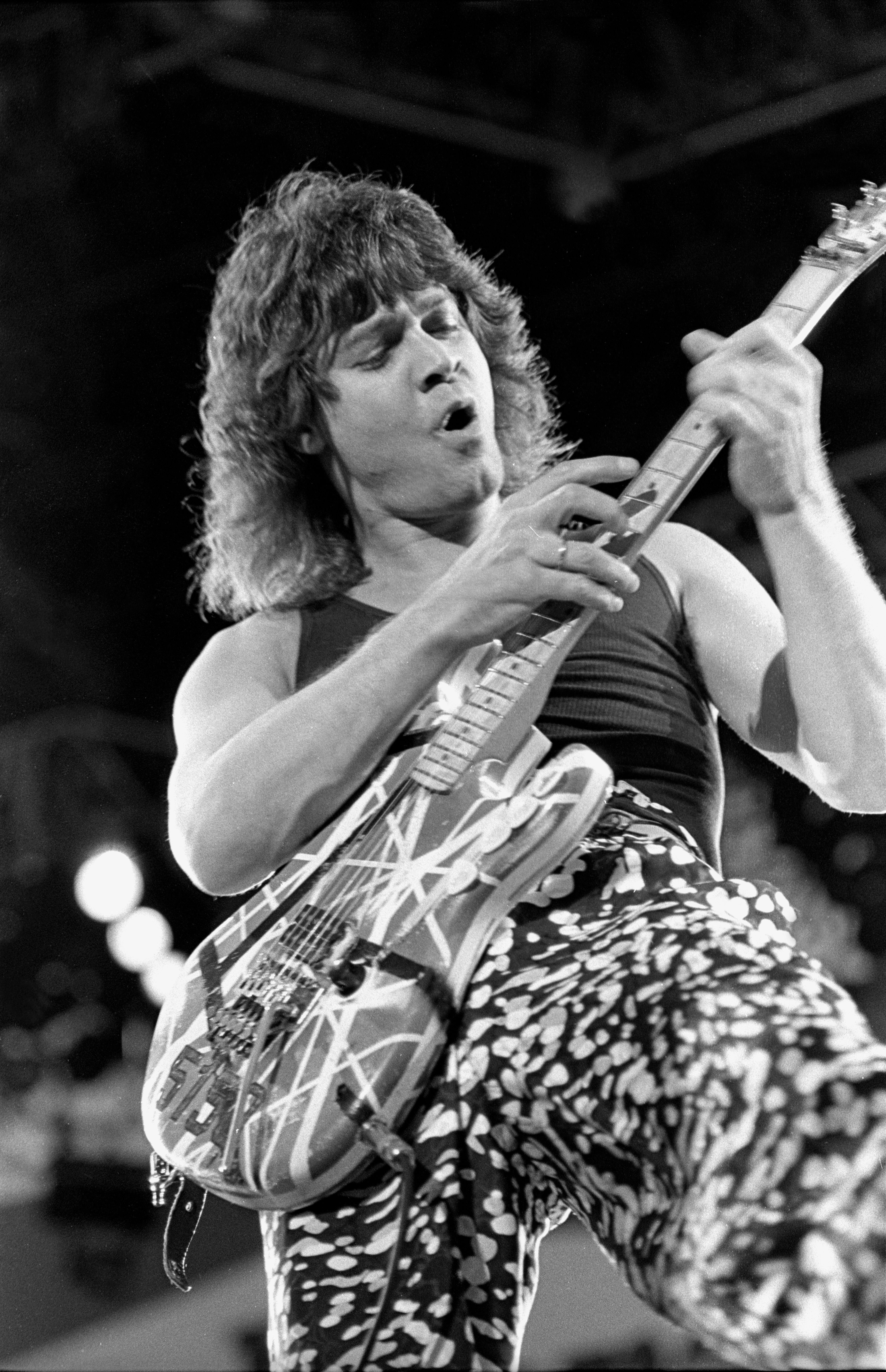 Eddie Van Halen performing on stage during a "live" concert appearance with Van Halen in 1988 | Source: Getty Images