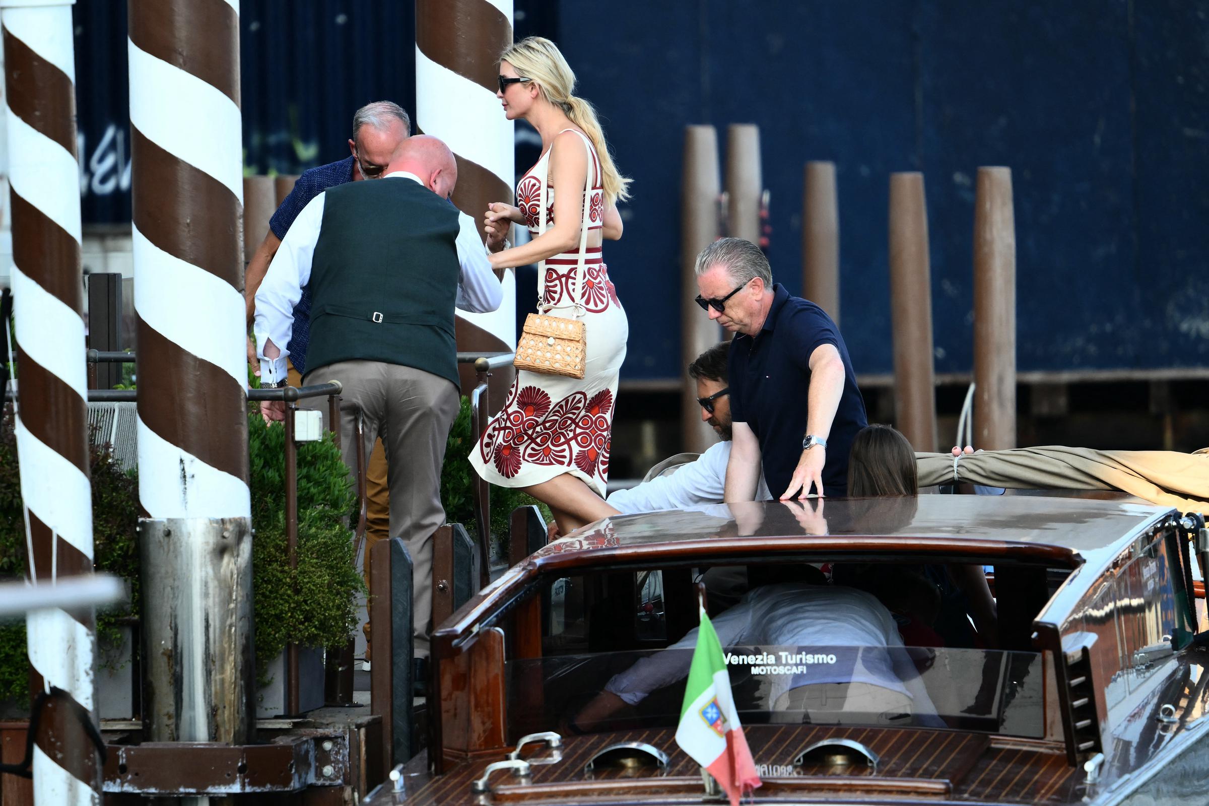 Ivanka Trump arrives at the St Regis Hotel ahead of Jeff Bezos' wedding on June 24, 2025. She is being helped out of a taxi boat.