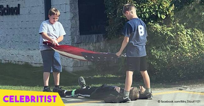 Photo of three fifth graders carefully taking down a U.S. flag goes viral