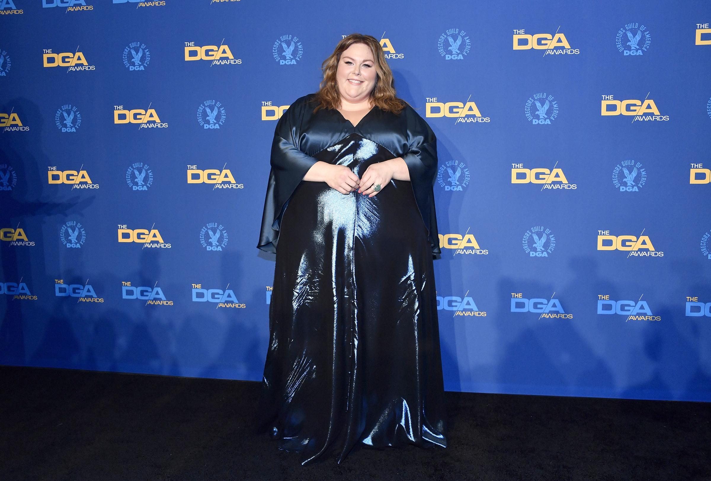 Metz posed in a dark navy gown with a glossy satin finish at the Directors Guild of America Awards. The image marks another stage before her later focus on strength training and GLP-1 treatment.
