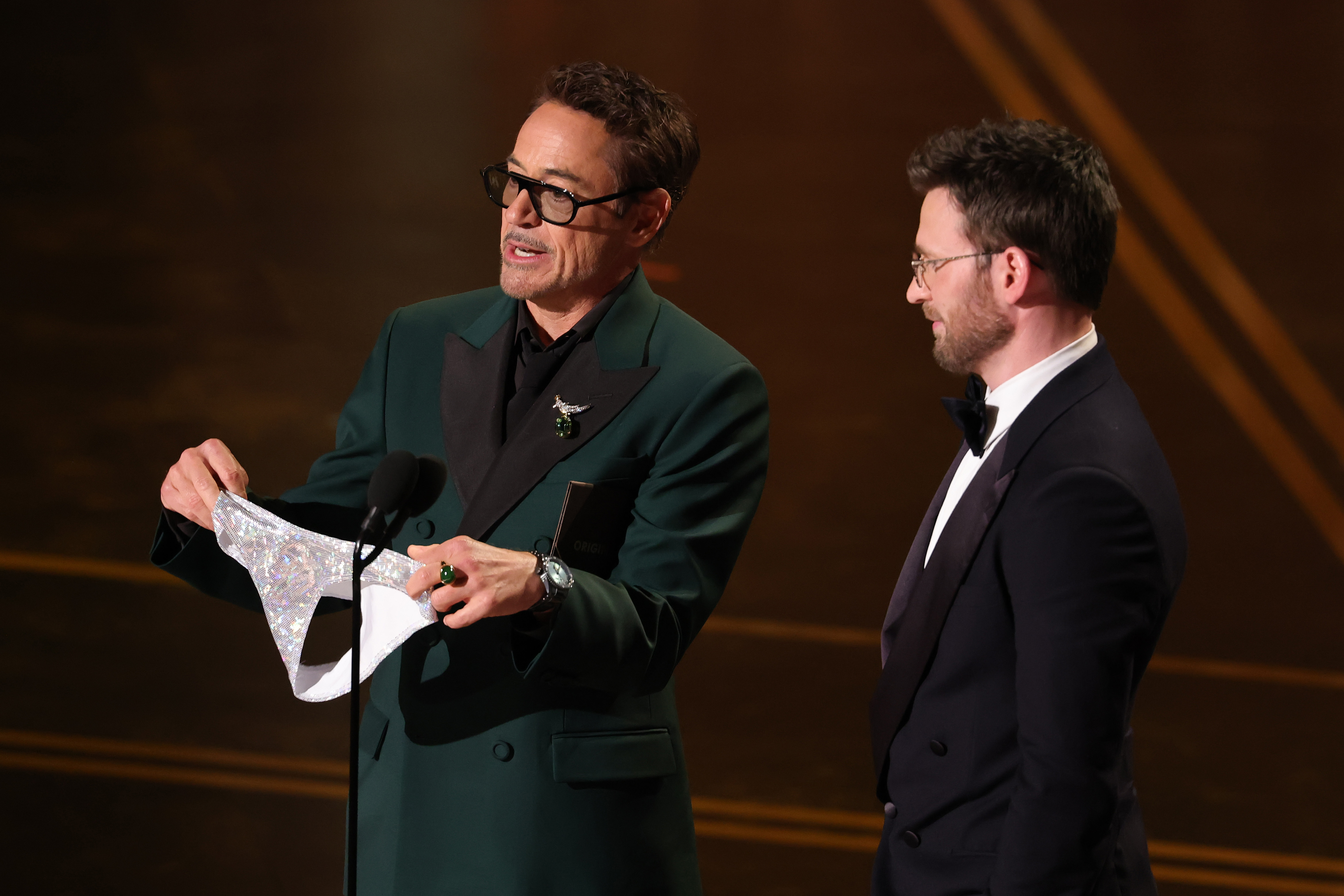 Robert Downey Jr. and Chris Evans speak onstage | Source: Getty Images
