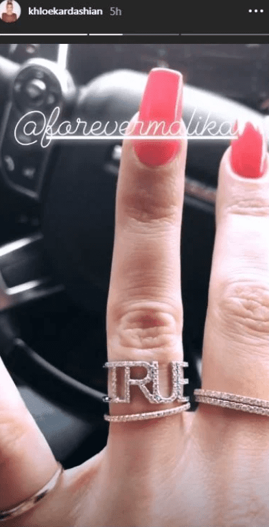 Khloe Kardashian's finger showing off a ring with her daughter's name, True inscribed on it | Photo: Instagram/khloekardashian
