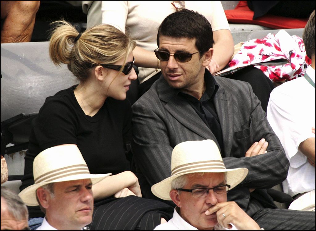 Patrick Bruel and Amanda Sthers at the 2005 Roland Garros tennis tournament - May 31, 2005 - in Paris, France.  |  Photo: Getty Images