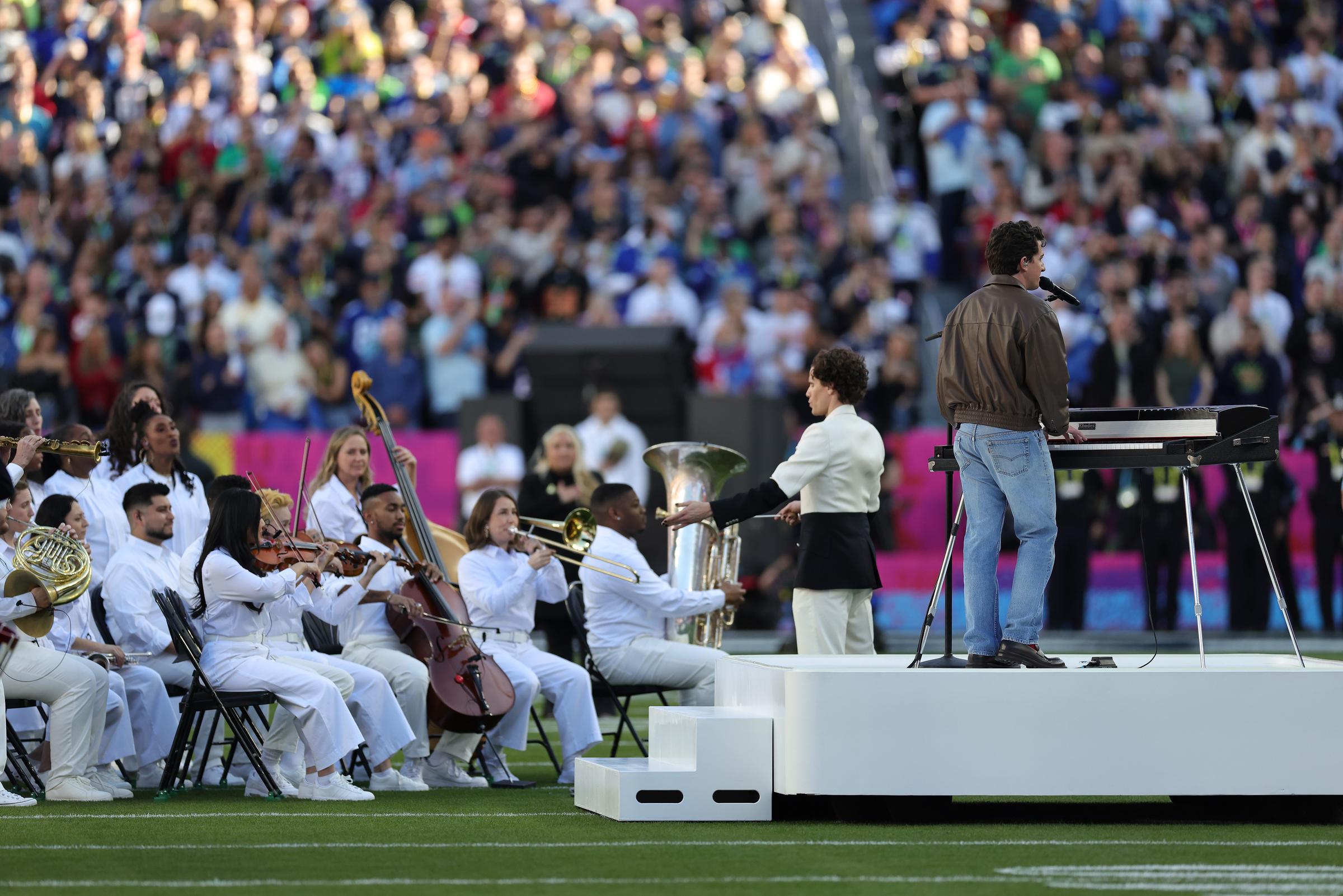Charlie Puth performs the National Anthem alongside an orchestra during Super Bowl LX at Levi’s Stadium in Santa Clara, California, on February 8, 2026 | Source: Getty Imges