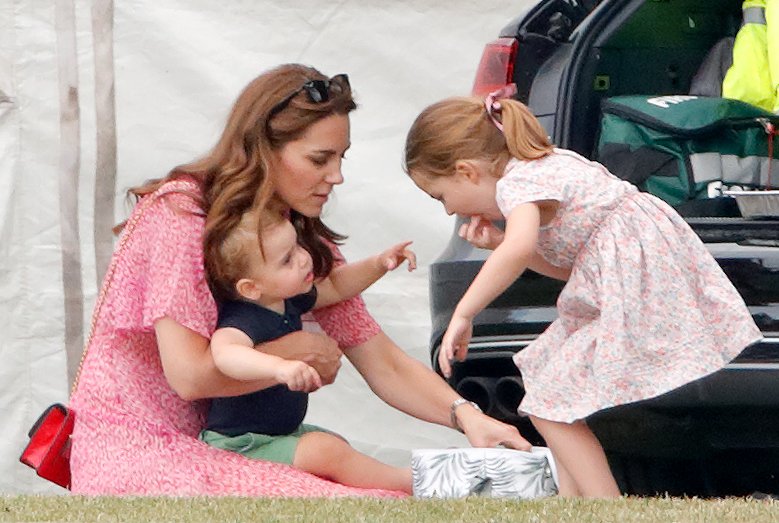 Catherine, Duchess of Cambridge, Prince Louis of Cambridge and Princess Charlotte of Cambridge at the King Power Royal Charity Polo Match at Billingbear Polo Club on July 10, 2019 in Wokingham, England. | Source: Getty Images