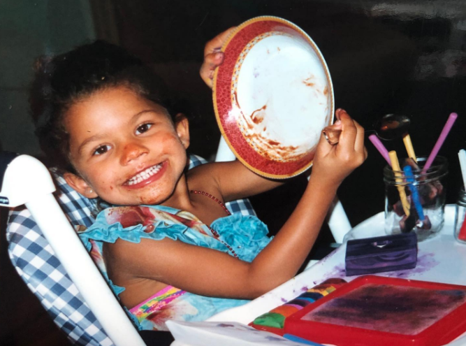 Fortunately for her fans, she has shared many cherished memories online. In this photo, she posed as a child while eating messily and smiling in a throwback image uploaded on September 2, 2021. | Source: Instagram/zendaya