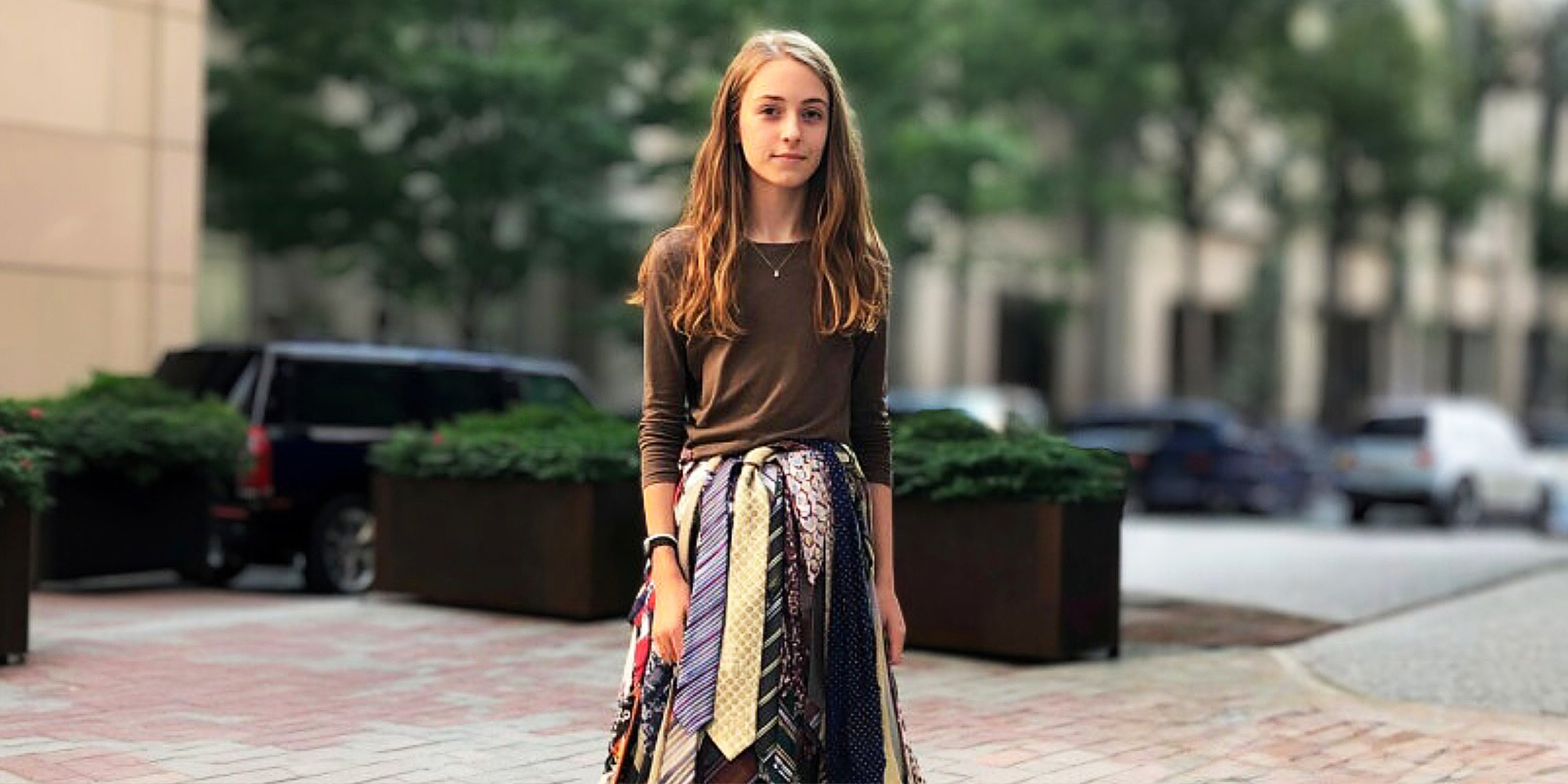 A girl wearing a skirt made out of ties | Source: AmoMama