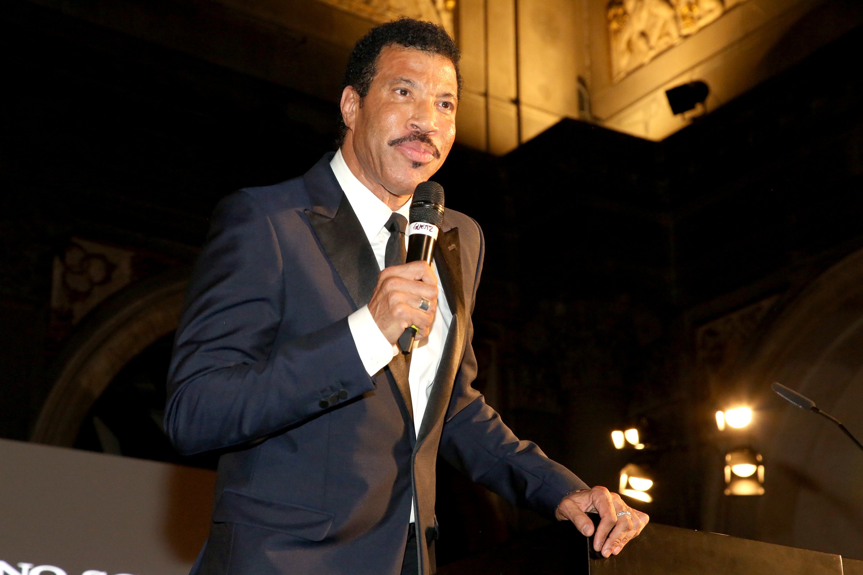  Lionel Richie accepting an award during the Celebrity Fight Night gala benefitting The Andrea Bocelli Foundation and The Muhammad Ali Parkinson Center in Florence, Italy | Photo: Rachel Murray/Getty Images for Celebrity Fight Night