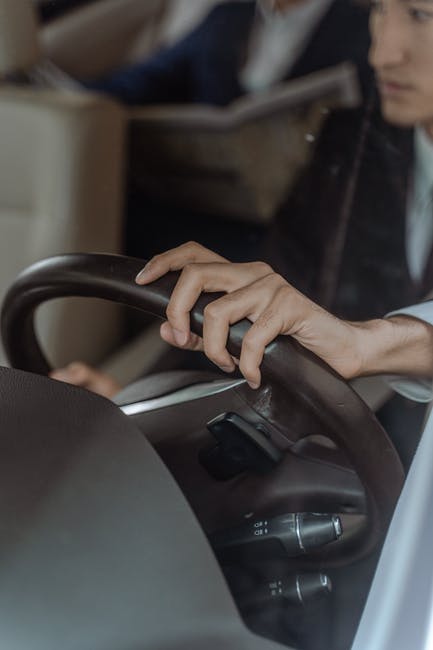 Donald, the company driver, picked Richard up in a matter of minutes after he called through the old lady's phone. | Source: Pexels