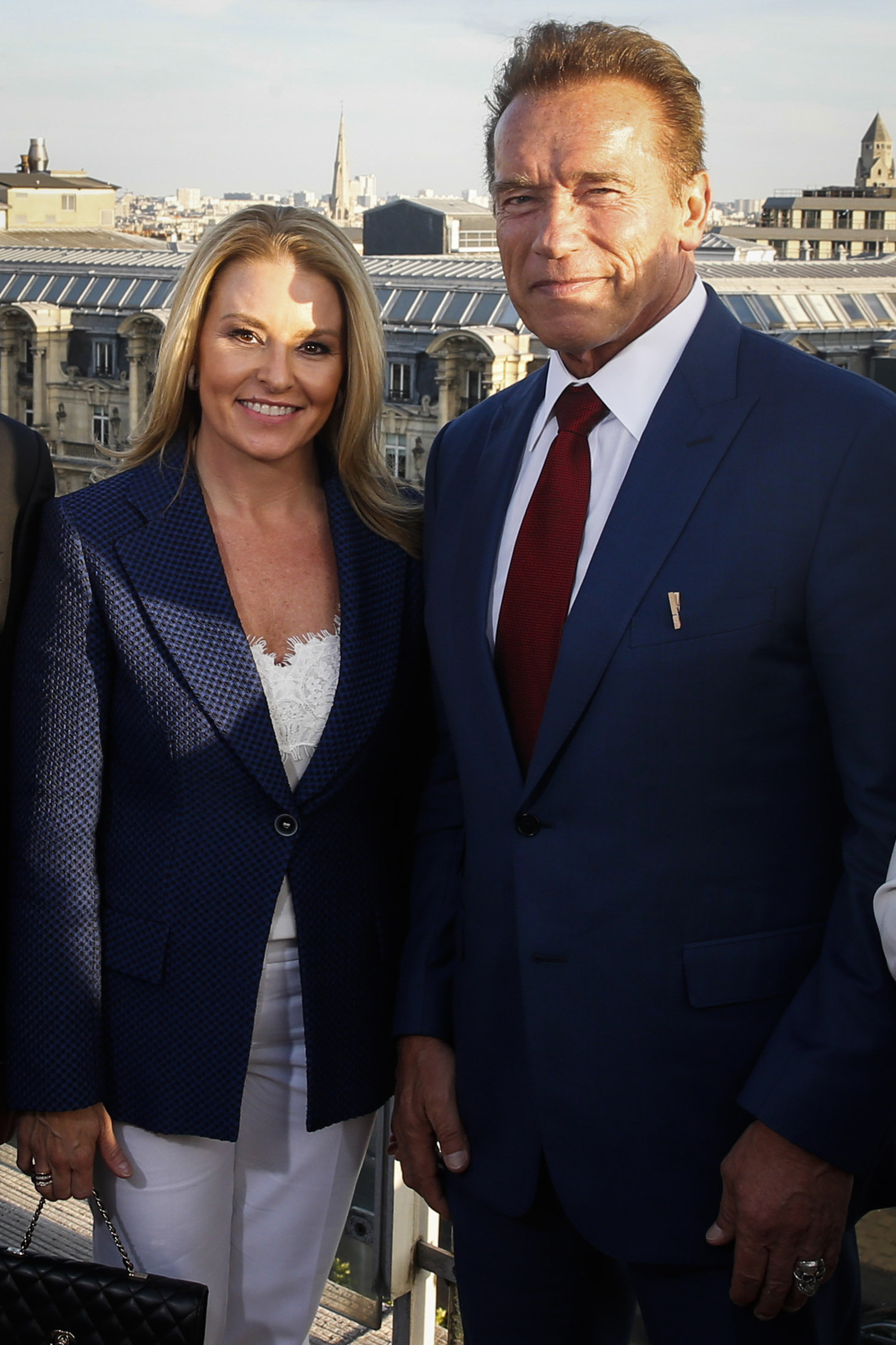 Arnold Schwarzenegger and his girlfriend Heather Milligan pose on June 23, 2017 in Paris | Source: Getty Images