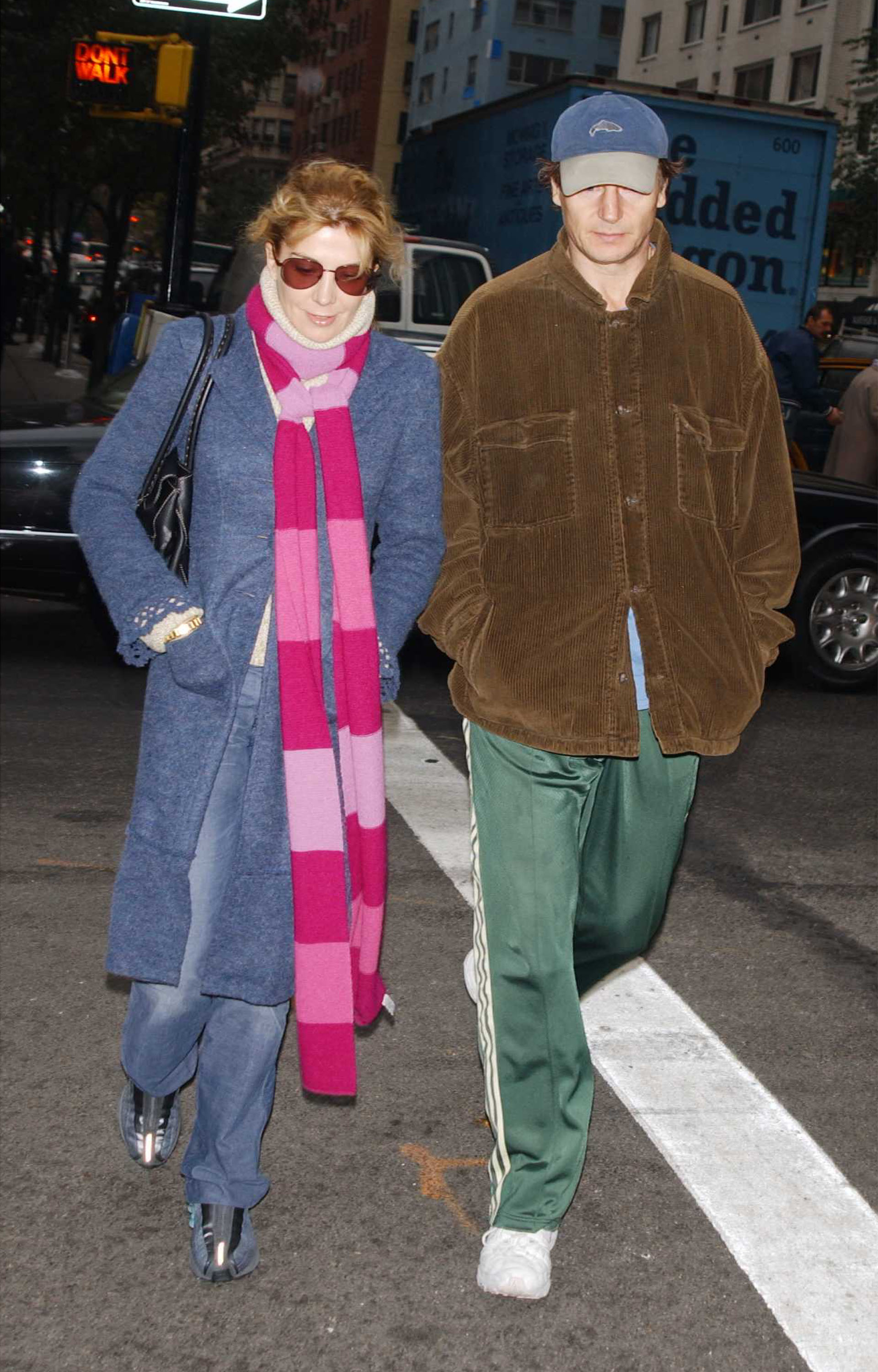 Natasha Richardson and Liam Neeson walk together on Madison Avenue in New York City on November 4, 2002. Both are dressed casually as they stroll through the city during their outing.