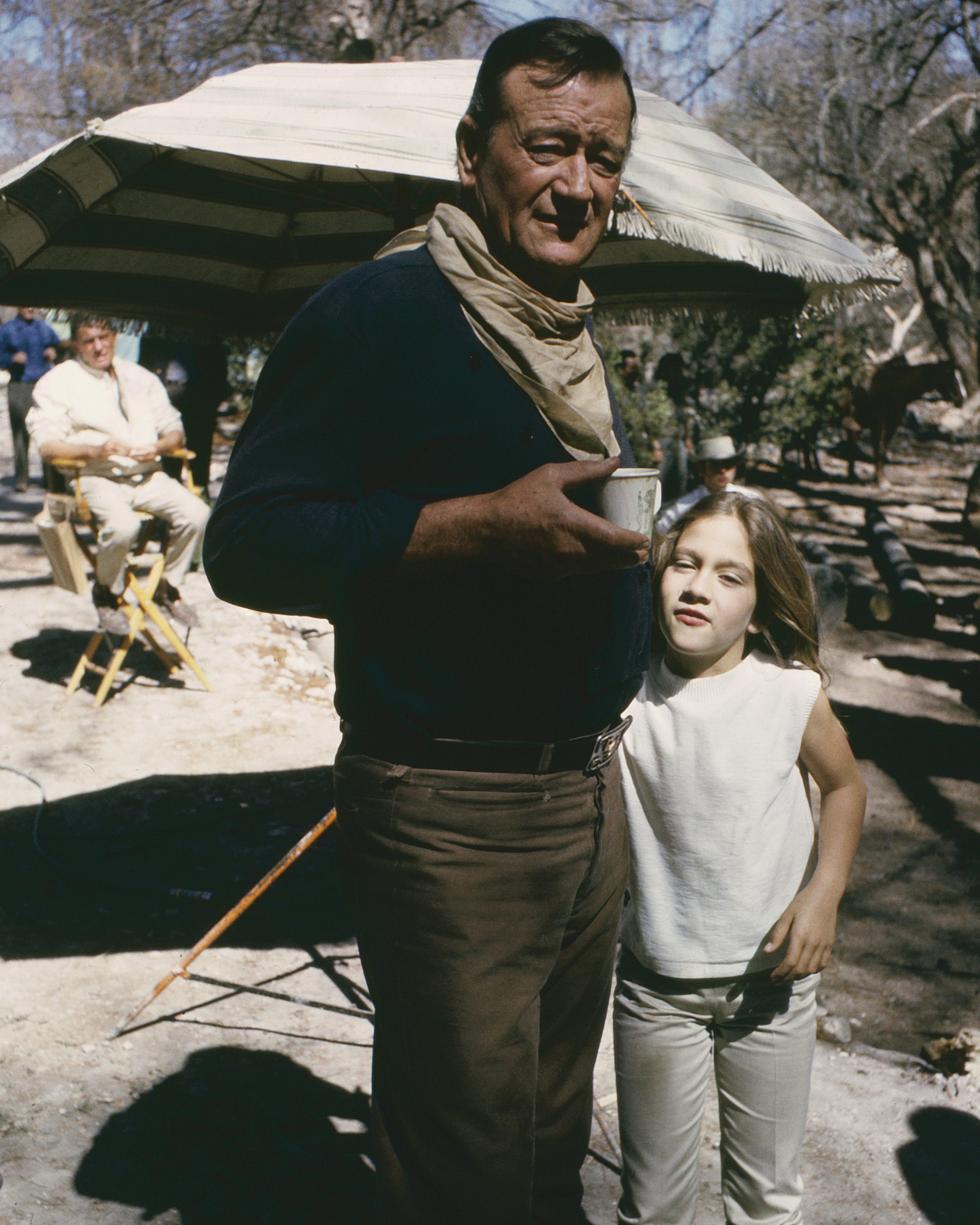 John Wayne as John Elder with his daughter, Aissa, on the set of "The Sons of Katie Elder" in 1965 | Source: Getty Images