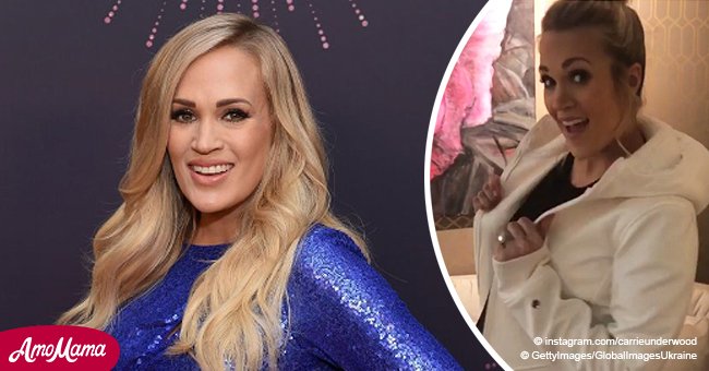 Carrie Underwood teases fans with a glimpse of her round baby bump just weeks before due date
