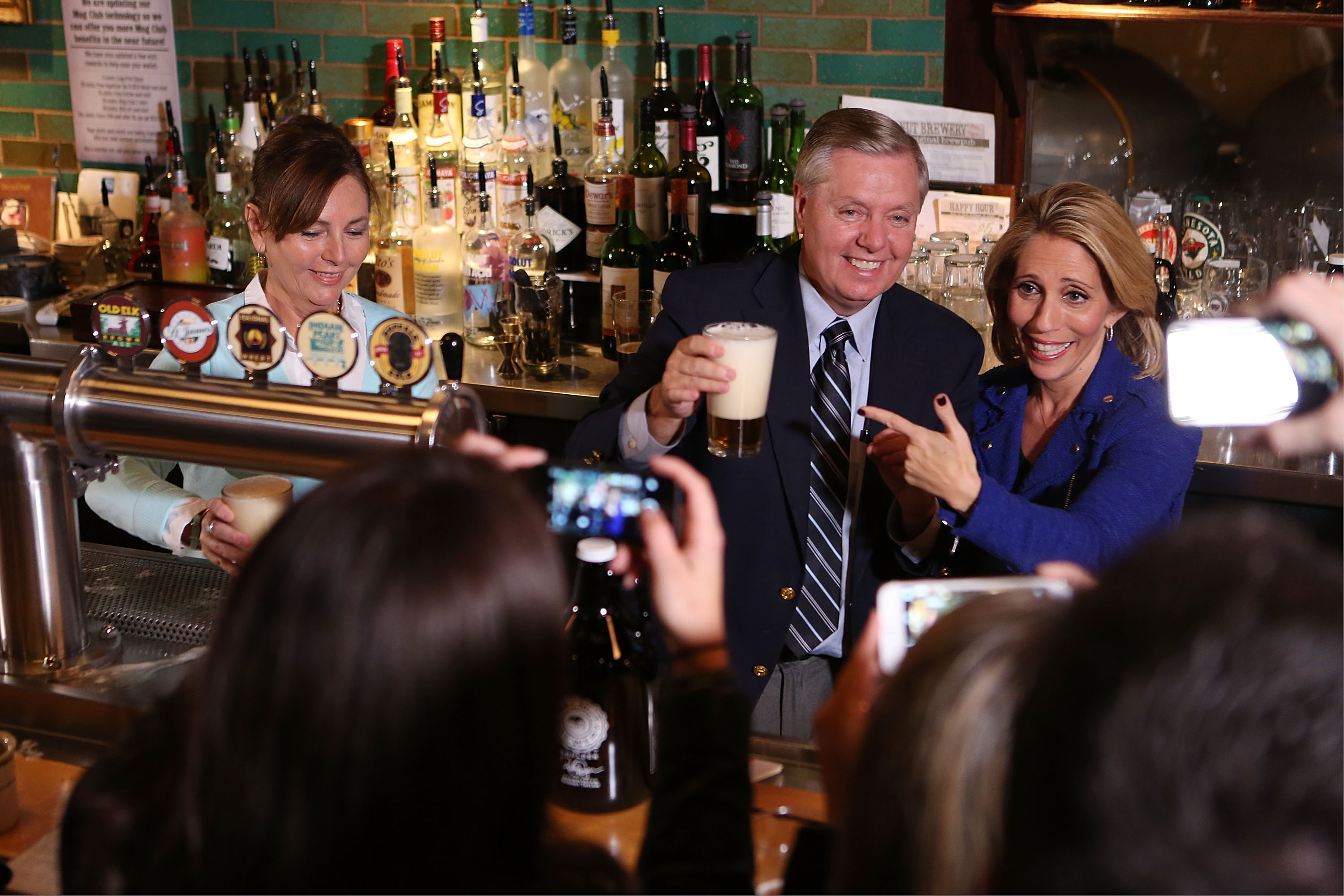 Lindsey Graham and his sister, Darline Graham Nordone, appear together during a 2015 campaign event. At the time, Graham said he believed she would be "a great representative" of the country if she were ever called to serve. | Source: Getty Images