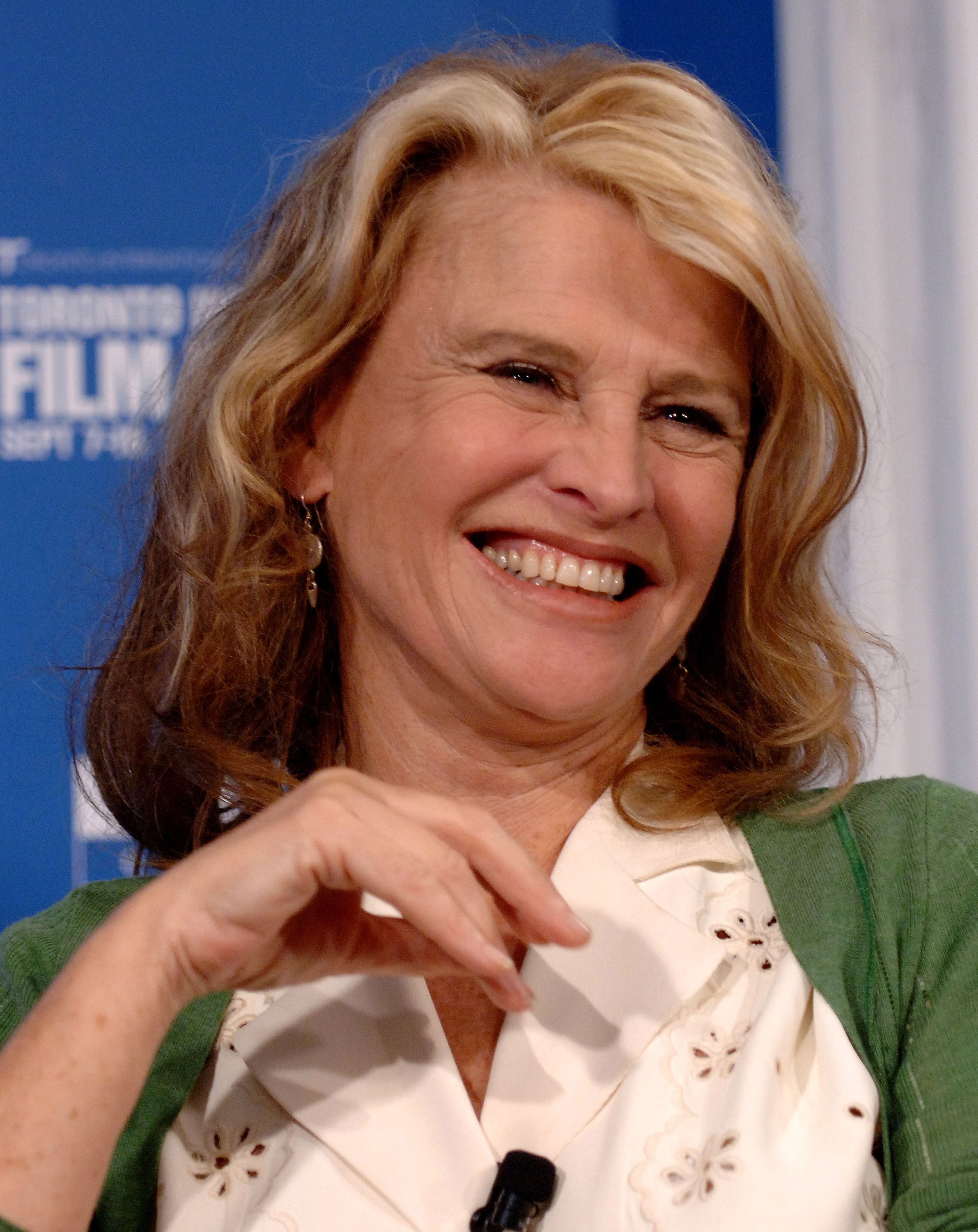 Christie shares a warm smile during a press conference for "Away from Her" at the 31st Annual Toronto International Film Festival in Toronto, Ontario. Radiating ease and charm, Christie reflects the grace and depth she brought to the acclaimed 2006 drama — a performance that earned widespread praise and renewed recognition for her enduring talent.