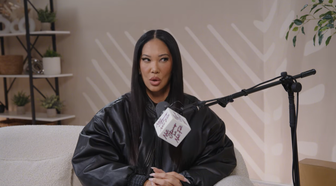 Kimora Lee Simmons maintains a serious expression while addressing the public backlash surrounding Aoki's brief romance | Source: YouTube/notskinnybutnotfat