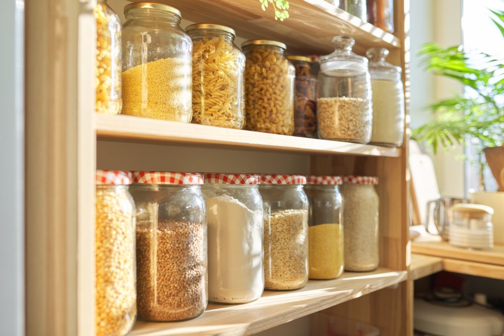 A photo of pantry with grain products in storage jars. | Photo: Shutterstock