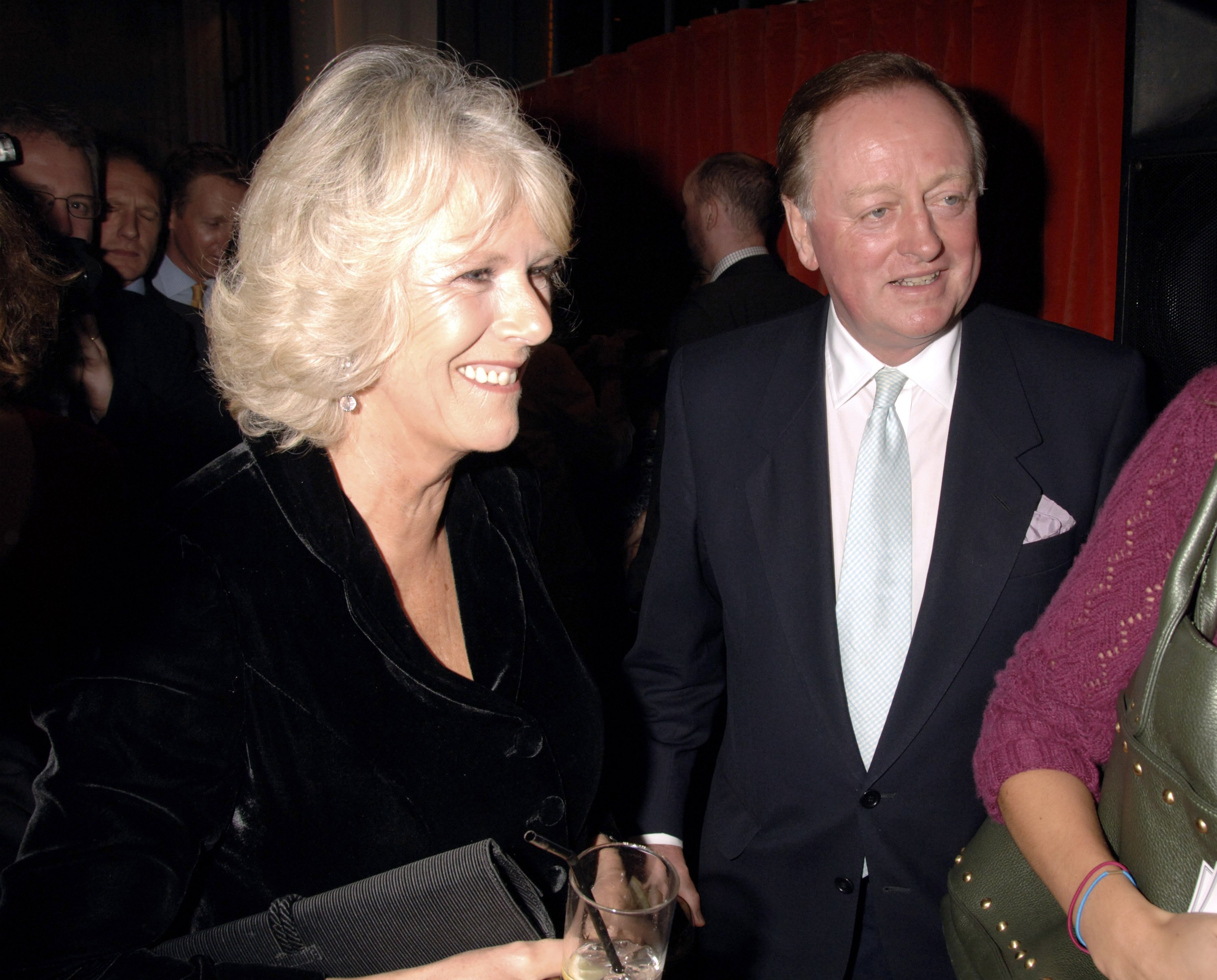 Camilla, Duchess of Cornwall and Andrew Parker Bowles attend the book launch of 'The Year Of Eating Dangerously' by Tom Parker Bowles, in London, England, on October 12, 2006. | Source: Getty Images
