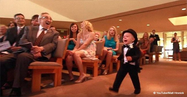 Little ring bearer makes such a hilarious entrance that guests laughing hysterically