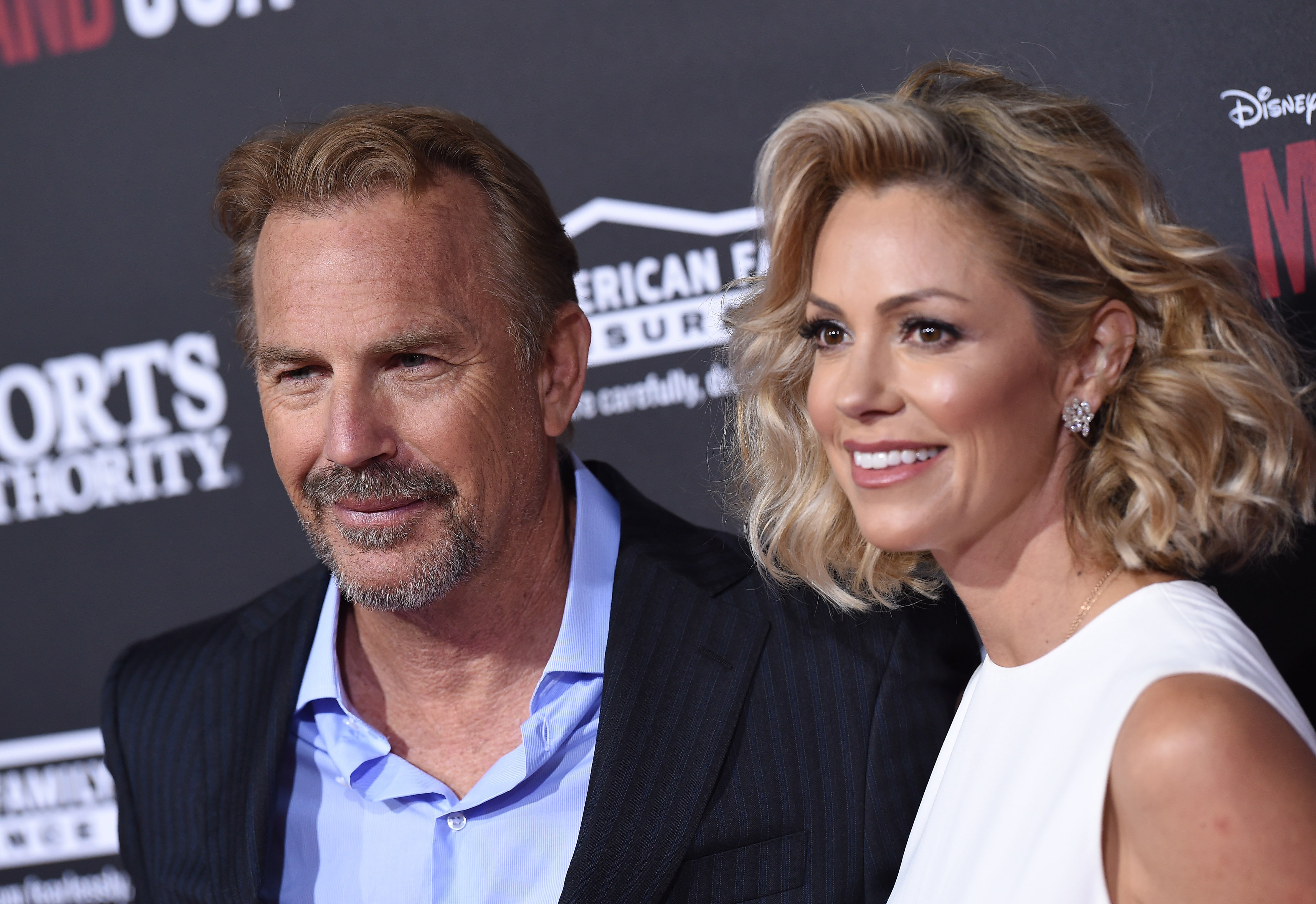 Kevin Costner and wife Christine Baumgartner arrive at the World Premiere of Disney's 'McFarland, USA' at the El Capitan Theatre on February 9, 2015, in Hollywood, California. | Source: Getty Images